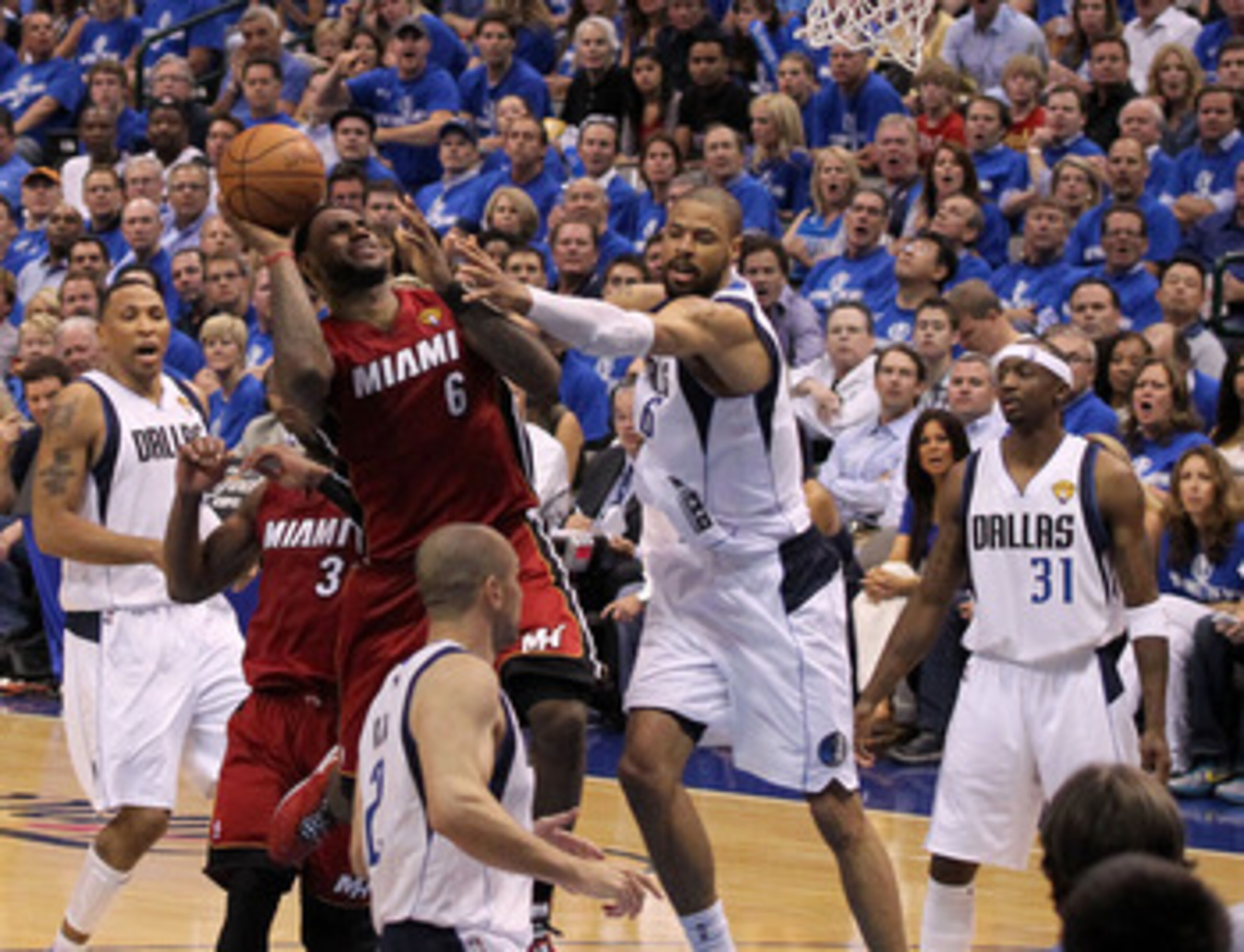 DALLAS, TX - JUNE 07:  LeBron James #6 of the Miami Heat attempts a shot against Tyson Chandler #6 of the Dallas Mavericks in Game Four of the 2011 NBA Finals at American Airlines Center on June 7, 2011 in Dallas, Texas. NOTE TO USER: User expressly ackno