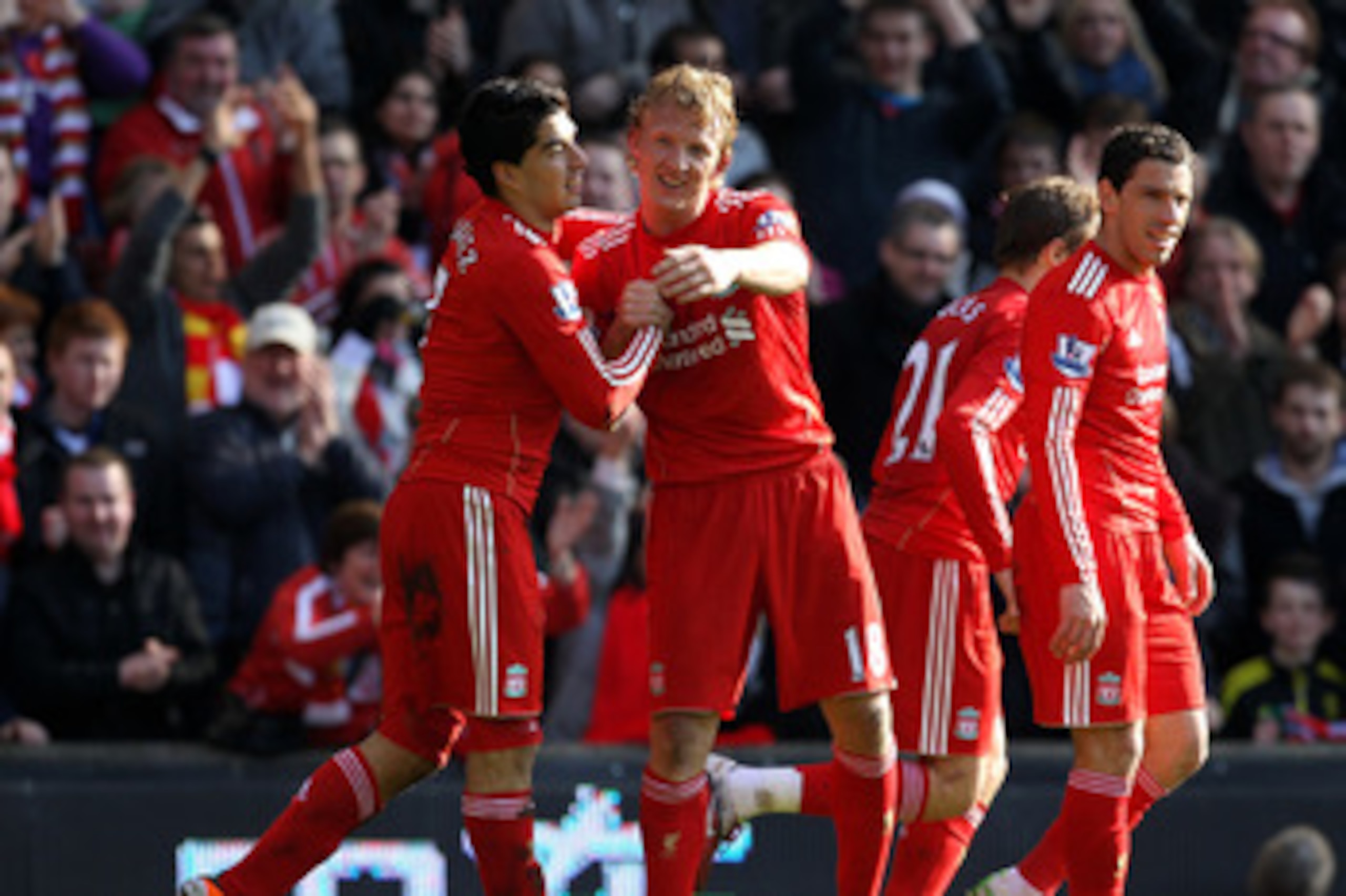 LIVERPOOL, ENGLAND - MARCH 06: Dirk Kuyt of Liverpool celebrates scoring the opening goal with team mate Luis Suarez (L) during the Barclays Premier League match between Liverpool and Manchester United at Anfield on March 6, 2011 in Liverpool, England. LIVERPOOL, ENGLAND - MARCH 06: Dirk Kuyt of Liverpool celebrates scoring the opening goal with team mate Luis Suarez (L) during the Barclays Premier League match between Liverpool and Manchester United at Anfield on March 6, 2011 in Liverpool, England.