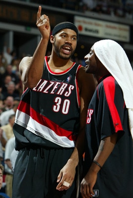 SACRAMENTO, CA -  JANUARY 20:   Rasheed Wallace #30 of the Portland Trail Blazers argues after receiving a technical foul as he is held back by teammate Jeff McInnis #5 against the Sacramento Kings during an NBA game on January 20, 2004 at Arco Arena in S