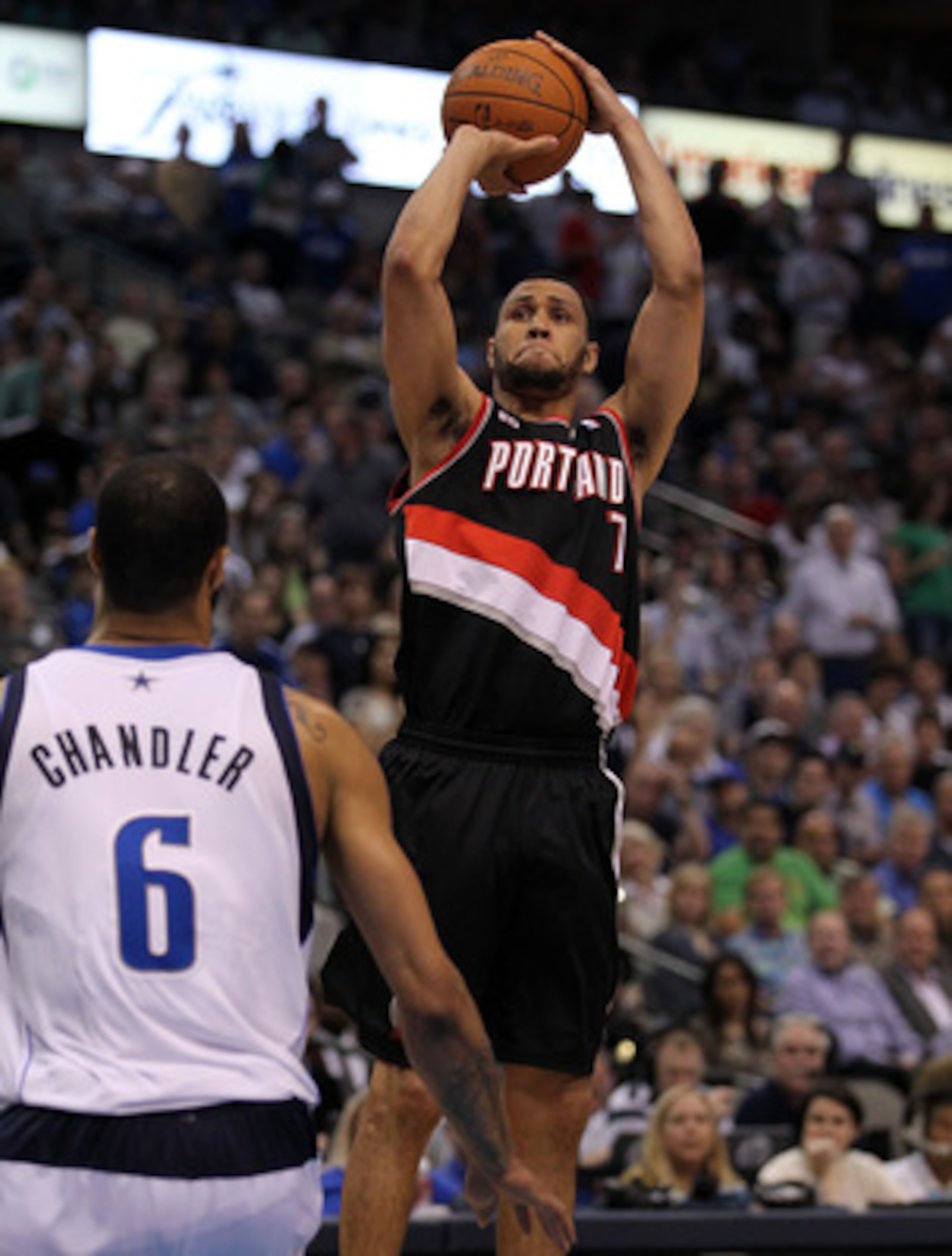 DALLAS, TX - APRIL 25:  Guard Brandon Roy #7 of the Portland Trail Blazers takes a shot against Tyson Chandler #6 of the Dallas Mavericks in Game Five of the Western Conference Quarterfinals during the 2011 NBA Playoffs on April 25, 2011 at American Airli