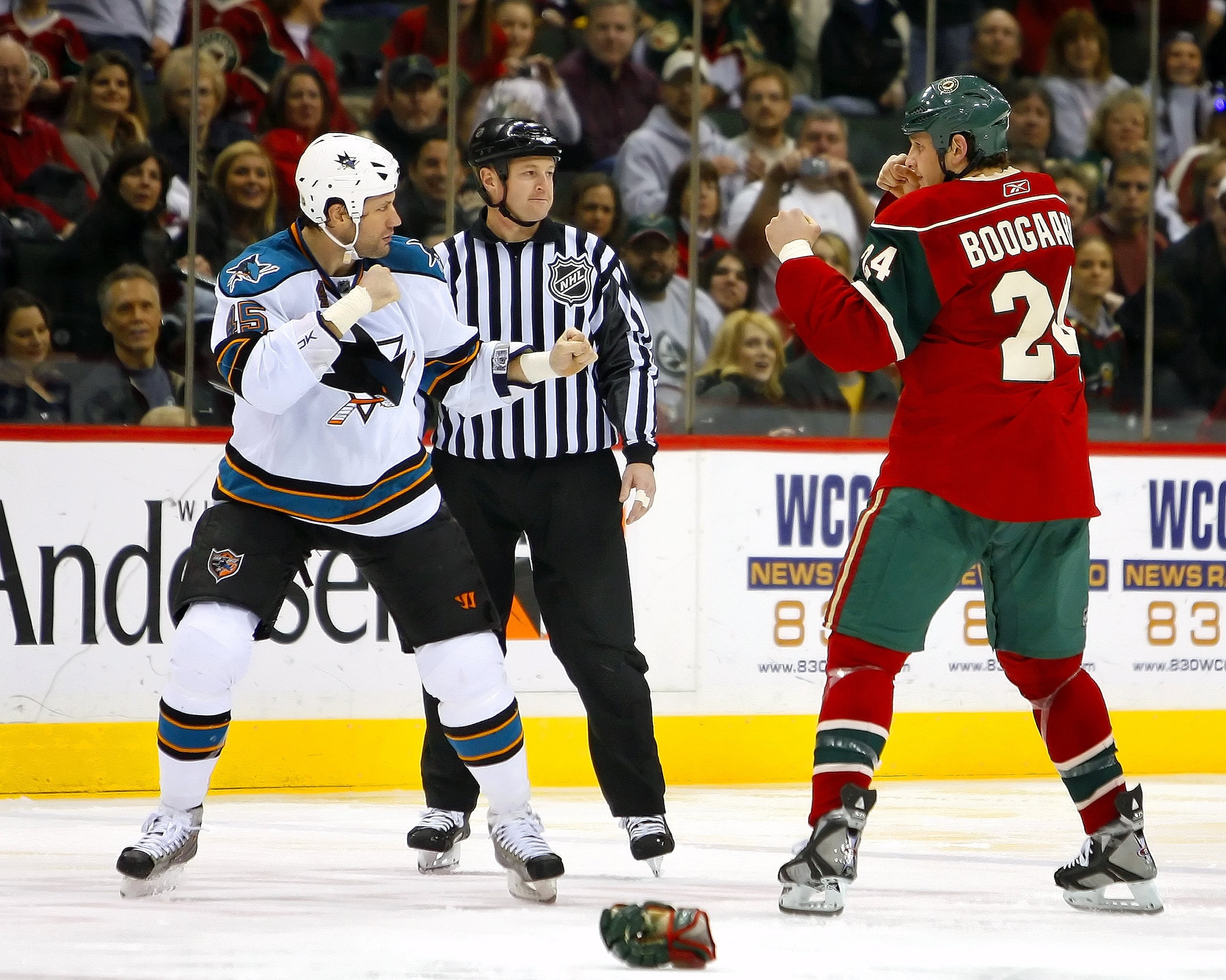 ST. PAUL, MN - DECEMBER 31:  Jody Shelley #45 of the San Jose Sharks and Derek Boogaard #24 of the Minnesota Wild square off to fight December 31, 2008 at the Xcel Energy Center in St. Paul, Minnesota. (Photo by Scott A. Schneider/Getty Images)