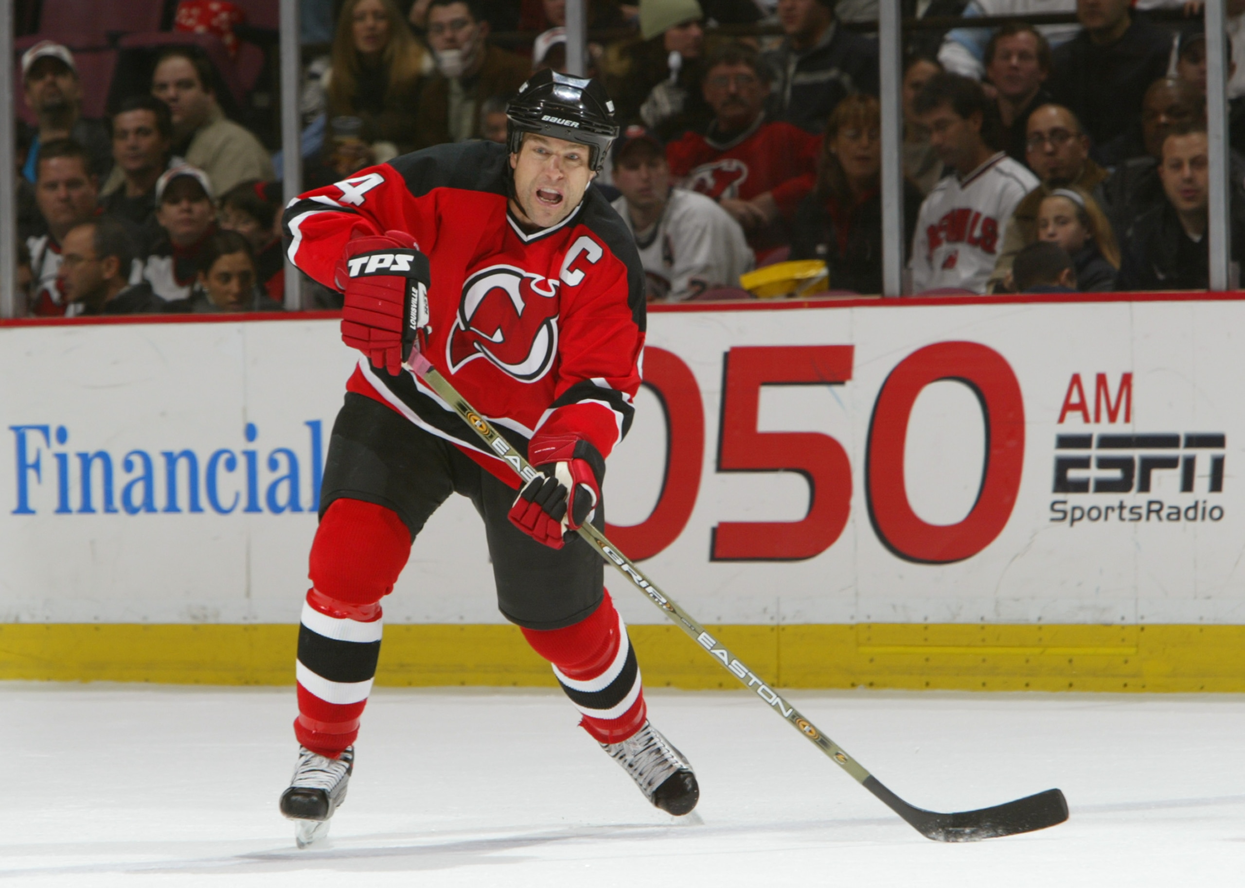 EAST RUTHERFORD, NJ - DECEMBER 10:  Defenseman Scott Stevens #4 of the New Jersey Devils shoots during the game against the New York Islanders on December 10, 2003 at Continental Airlines Arena in East Rutherford, New Jersey. The Devils won 1-0. (Photo by