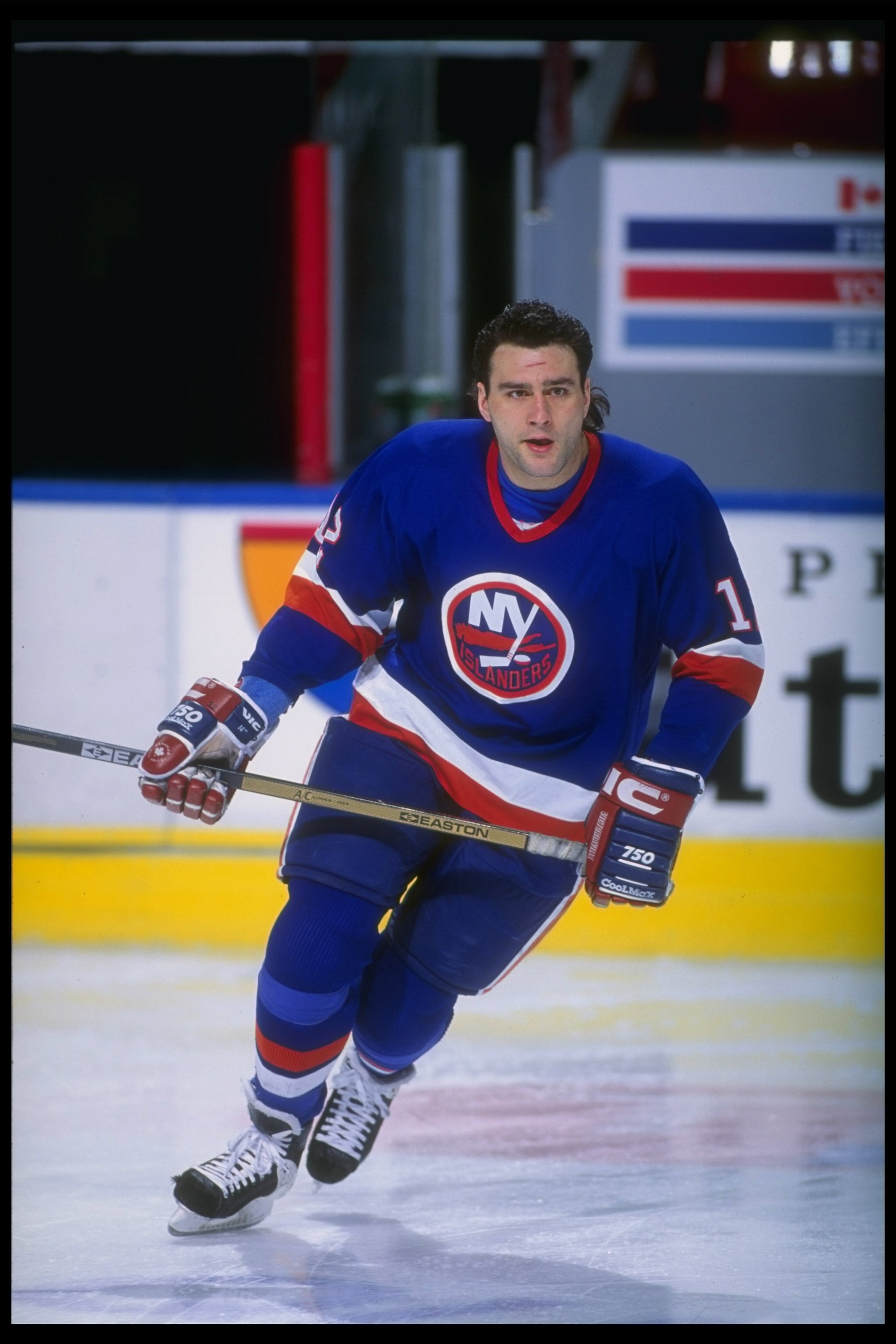 Rightwinger Marty McInnis of the New York Islanders moves down the ice during a game against the Quebec Nordiques at the Quebec Coliseum in Quebec City, Quebec.