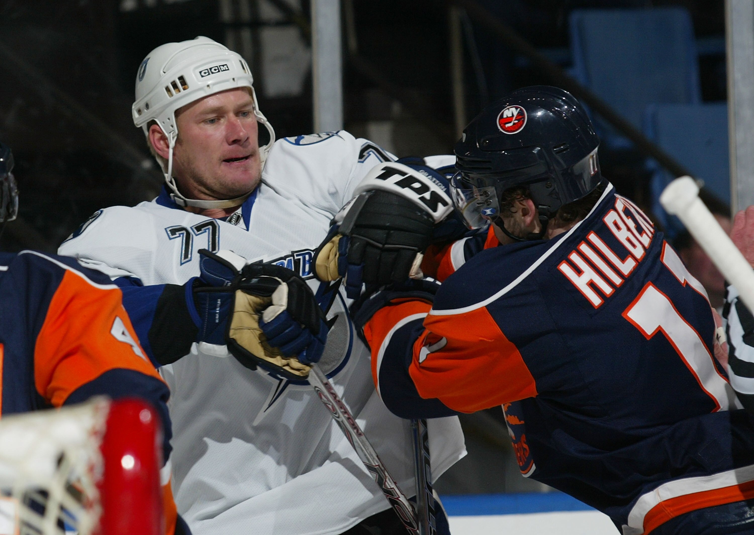 UNIONDALE, NY - FEBRUARY 21: Chris Gratton #77 of the Tampa Bay Lightning is pushed out of the crease by Andy Hilbert #11 of the New York Islanders on February 21, 2008 at the Nassau Coliseum in Uniondale, New York.  (Photo by Bruce Bennett/Getty Images)