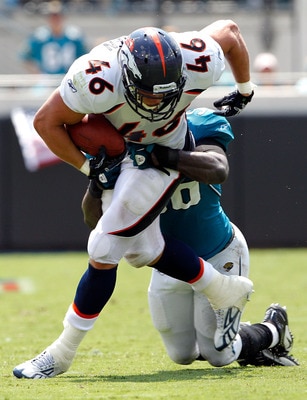 JACKSONVILLE, FL - SEPTEMBER 12:  Spencer Larsen #46 of the Denver Broncos is tackled by Justin Durant #56 of the Jacksonville Jaguars during the NFL season opener game at EverBank Field on September 12, 2010 in Jacksonville, Florida.  (Photo by Sam Green