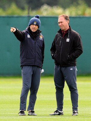 MANCHESTER, ENGLAND - MAY 12:  Manchester City manager Roberto Mancini (L) makes a point to his assistant David Platt during a training session at Carrington Training Ground on May 12, 2011 in Manchester, England.  (Photo by Chris Brunskill/Getty Images)