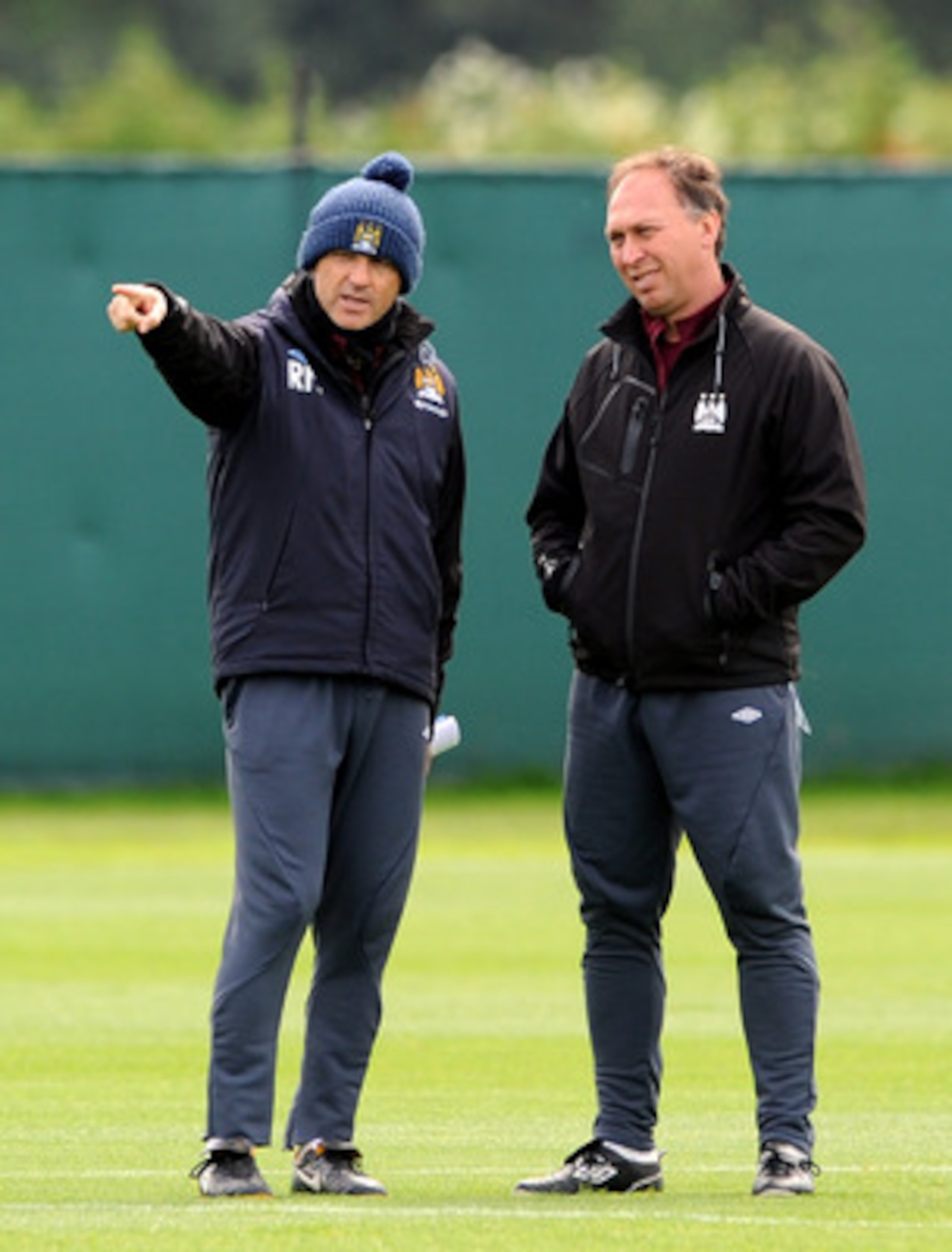 MANCHESTER, ENGLAND - MAY 12:  Manchester City manager Roberto Mancini (L) makes a point to his assistant David Platt during a training session at Carrington Training Ground on May 12, 2011 in Manchester, England.  (Photo by Chris Brunskill/Getty Images)
