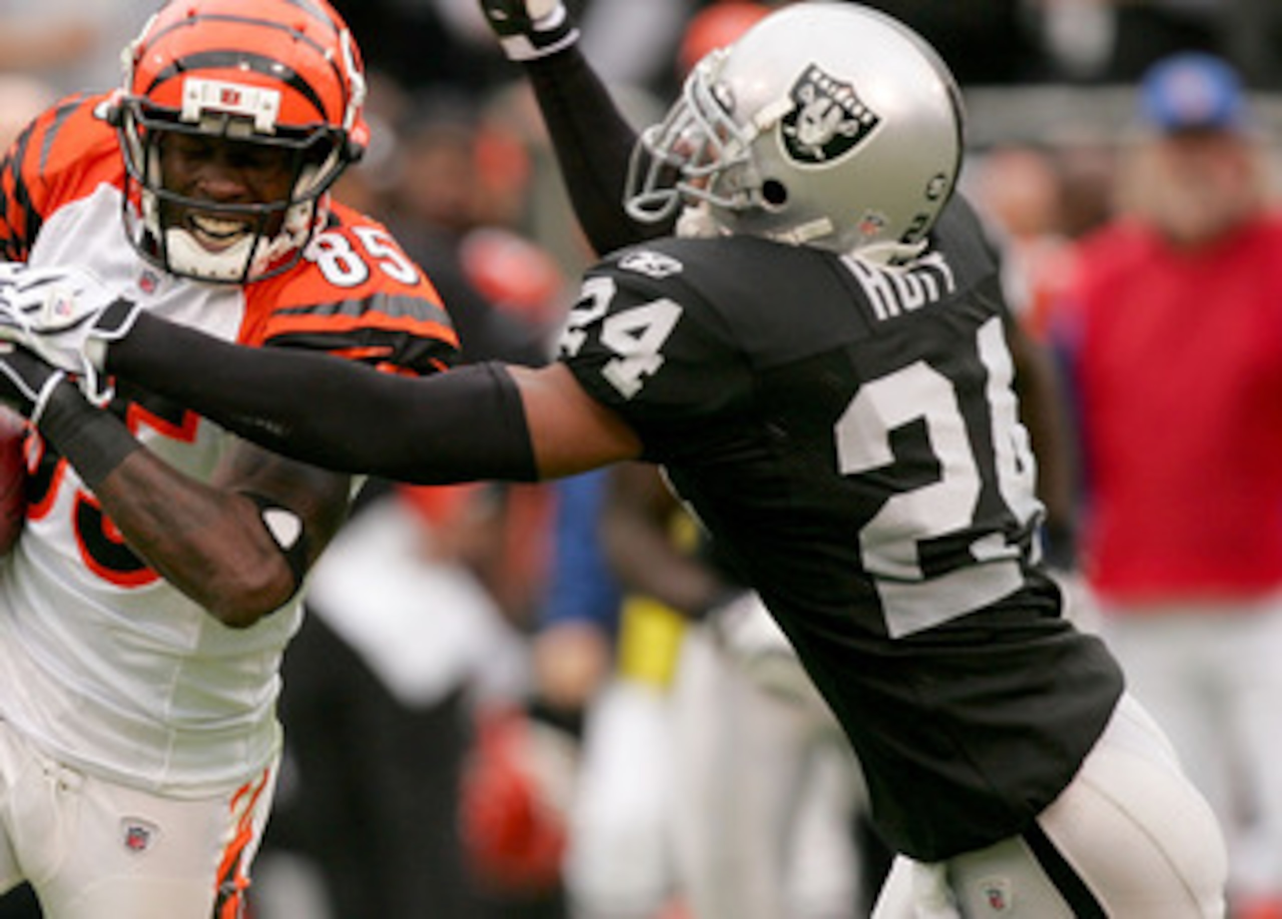 OAKLAND, CA - NOVEMBER 22: Chad Ochocinco #85 of the Cincinnati Bengals is tackled by Michael Huff #24 of the Oakland Raiders at Oakland-Alameda County Coliseum on November 22, 2009 in Oakland, California. (Photo by Ezra Shaw/Getty Images) OAKLAND, CA - NOVEMBER 22: Chad Ochocinco #85 of the Cincinnati Bengals is tackled by Michael Huff #24 of the Oakland Raiders at Oakland-Alameda County Coliseum on November 22, 2009 in Oakland, California. (Photo by Ezra Shaw/Getty Images)