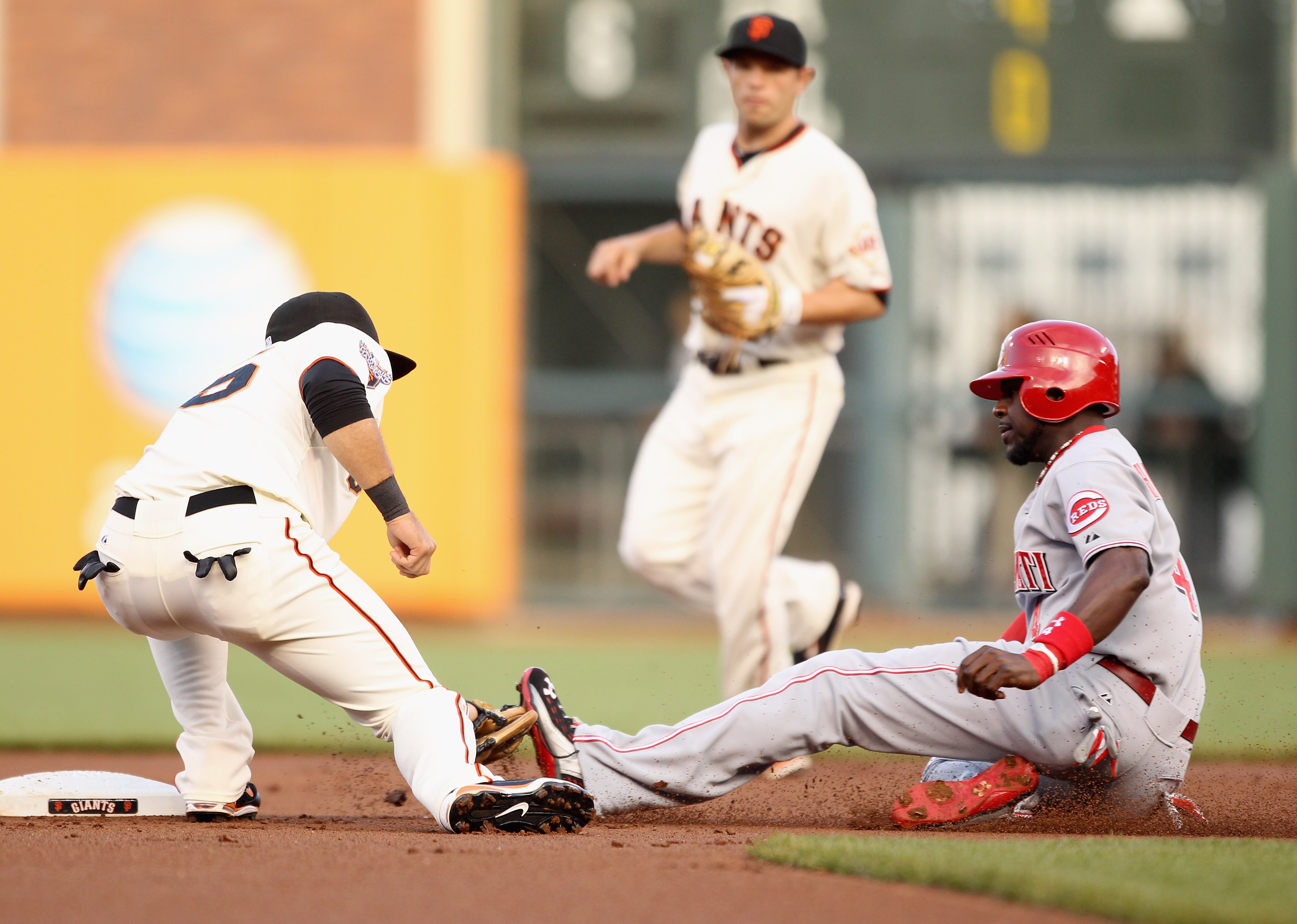 SAN FRANCISCO, CA - JUNE 09:  Brandon Phillips #4 of the Cincinnati Reds is tagged out by Brandon Crawford #35 of the San Francisco Giants on a steal attempt in the first inning at AT&T Park on June 9, 2011 in San Francisco, California.  (Photo by Ezra Sh