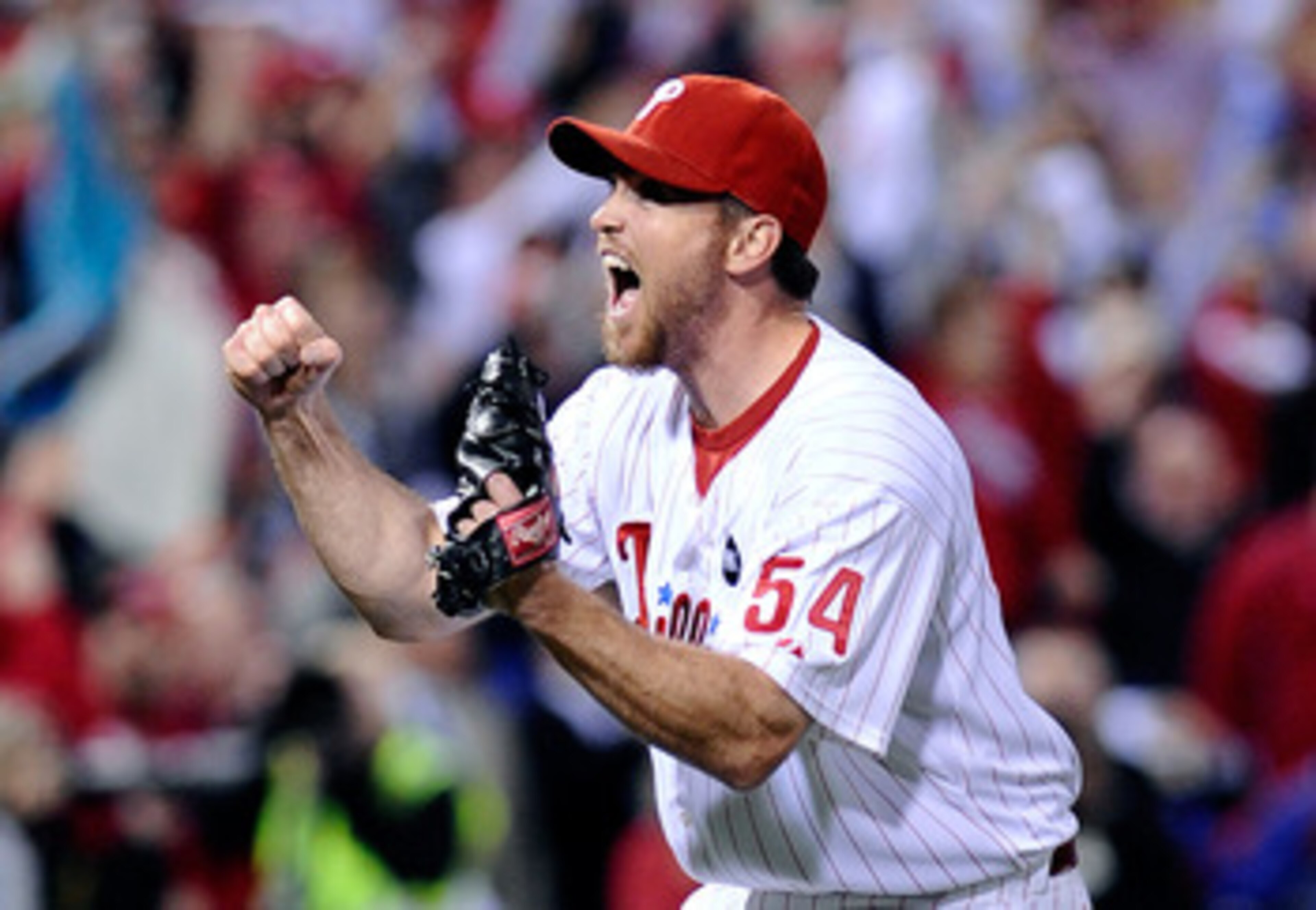 PHILADELPHIA - OCTOBER 21: Brad Lidge #54 of the Philadelphia Phillies celebrates defeating the Los Angeles Dodgers 10-4 to advance to the World Series in Game Five of the NLCS during the 2009 MLB Playoffs at Citizens Bank Park on October 21, 2009 in Phil