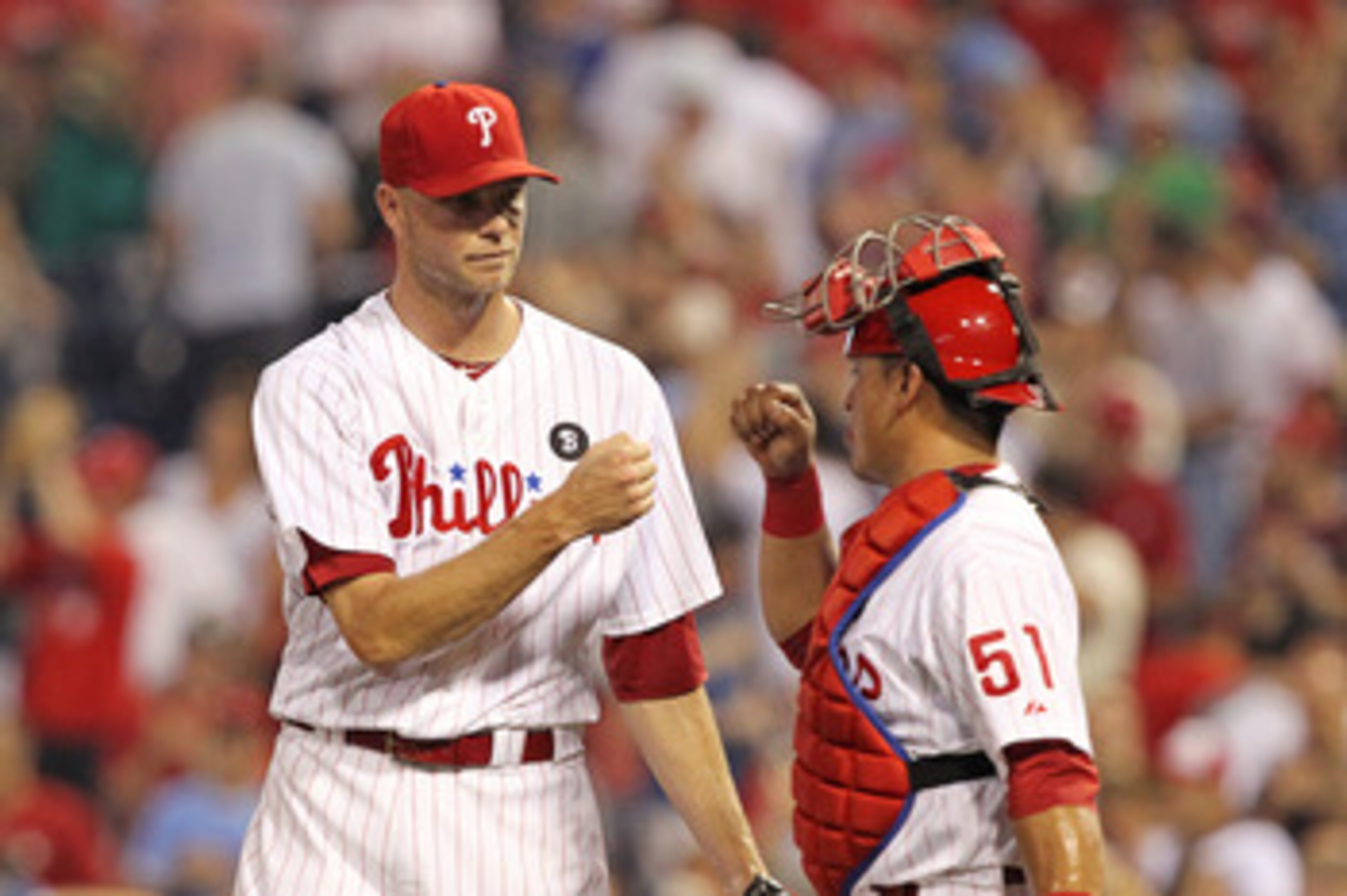 PHILADELPHIA - JUNE 8: Relief pitcher Ryan Madson #46 of the Philadelphia Phillies is congratulated by catcher Carlos Ruiz #51 after closing out the game against the Los Angeles Dodgers at Citizens Bank Park on June 8, 2011 in Philadelphia, Pennsylvania.