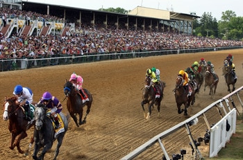 BALTIMORE, MD - MAY 21:  The field heads into the first turn during the 136th running of the Preakness Stakes at Pimlico Race Course on May 21, 2011 in Baltimore, Maryland.  (Photo by Rob Carr/Getty Images)