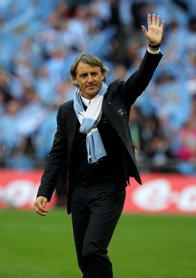 LONDON, ENGLAND - MAY 14:  Roberto Mancini salutes the fans after his Manchester City team won the FA Cup sponsored by E.ON Final match between Manchester City and Stoke City at Wembley Stadium on May 14, 2011 in London, England.  (Photo by Alex Livesey/G