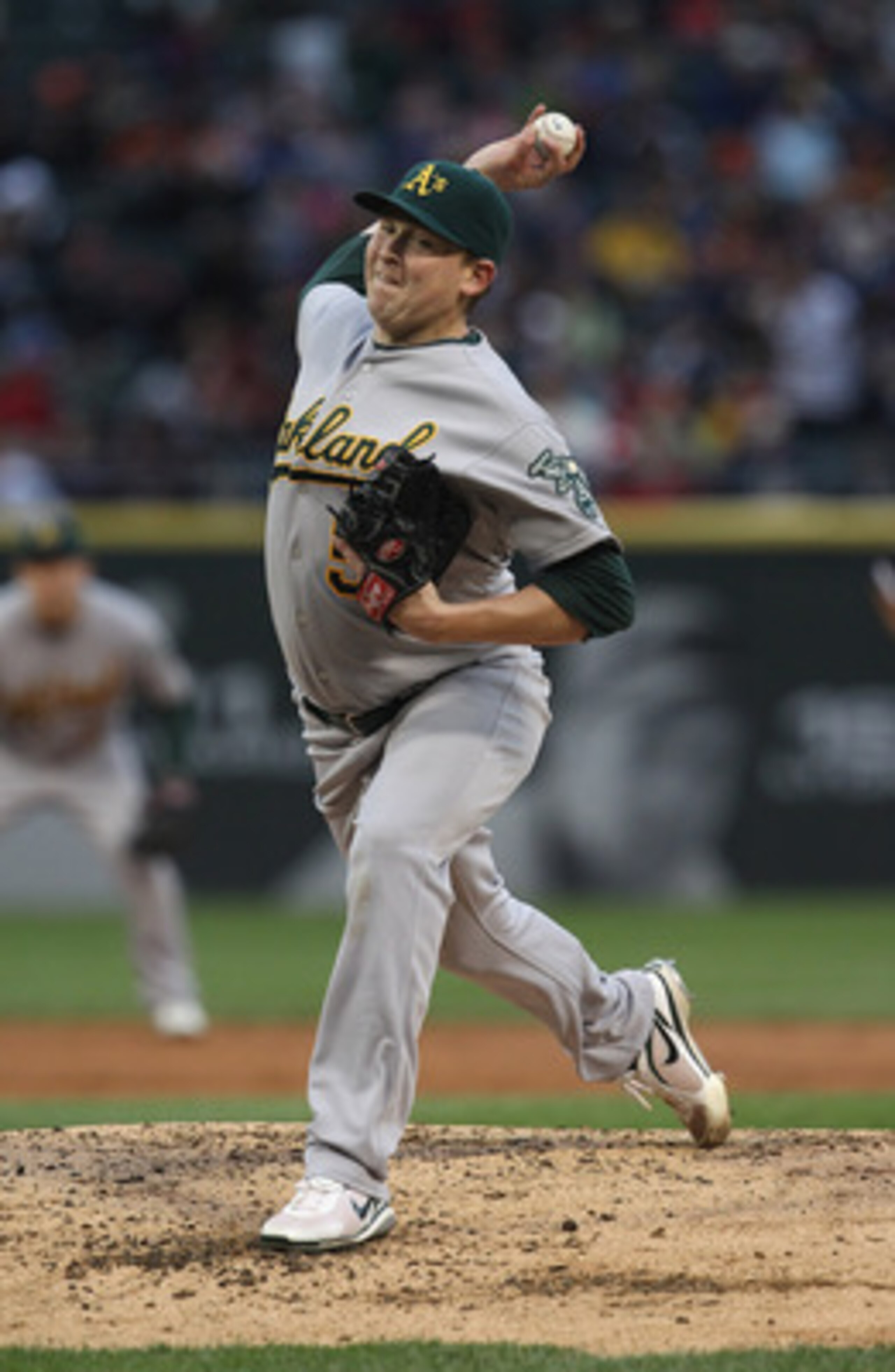 CHICAGO, IL - JUNE 09:  Starting pitcher Trevor Cahill #53 of the Oakland Athletics delivers the ball against the Chicago White Sox at U.S. Cellular Field on June 9, 2011 in Chicago, Illinois.  (Photo by Jonathan Daniel/Getty Images)