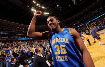DENVER, CO - MARCH 17:  Kenneth Faried #35 of the Morehead State Eagles celebrates after defeating the Louisville Cardinals during the second round of the 2011 NCAA men's basketball tournament at Pepsi Center on March 17, 2011 in Denver, Colorado. The Mor
