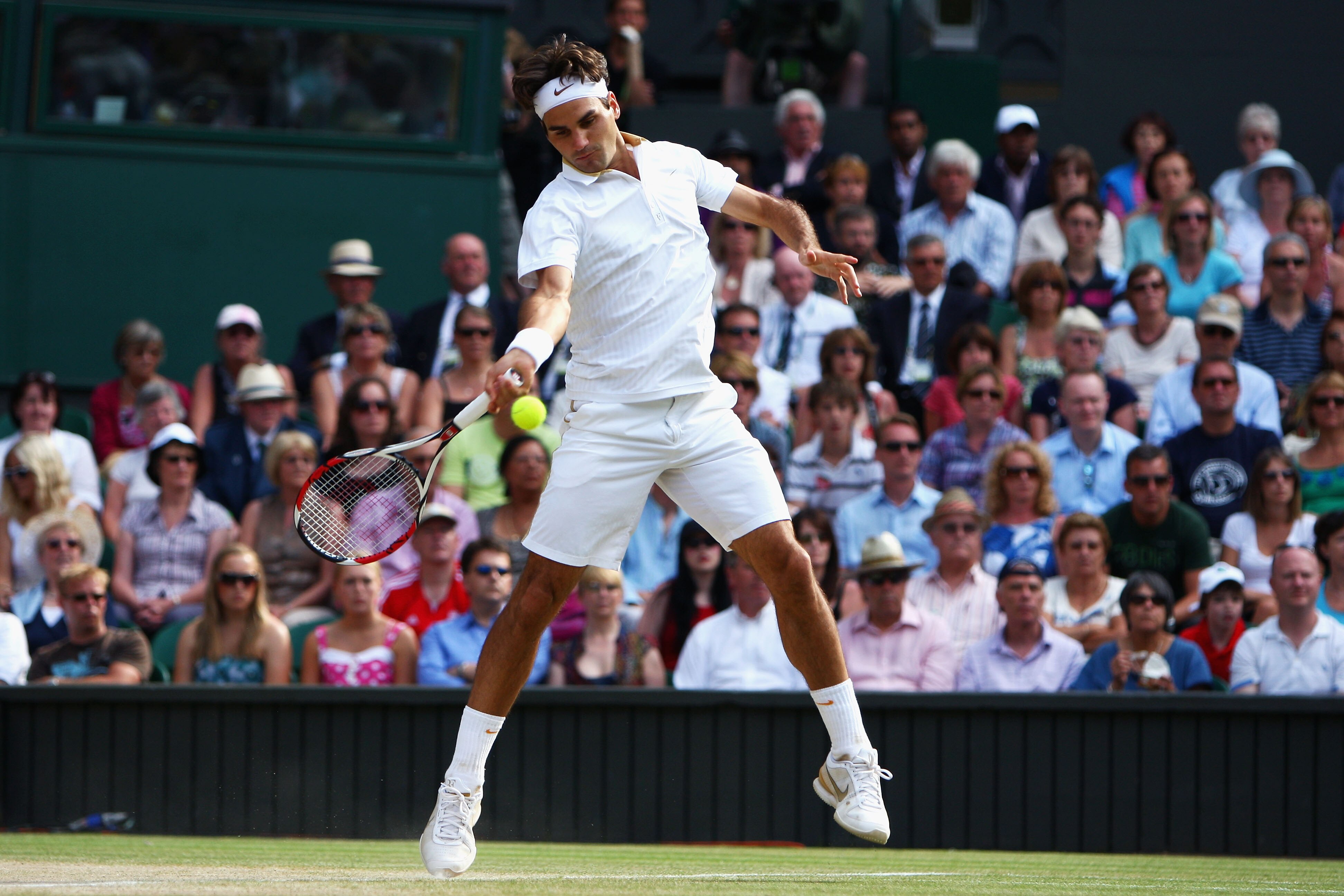WIMBLEDON, ENGLAND - JULY 05:  Roger Federer of Switzerland plays a forehand during the men's singles final match against Andy Roddick of USA on Day Thirteen of the Wimbledon Lawn Tennis Championships at the All England Lawn Tennis and Croquet Club on Jul