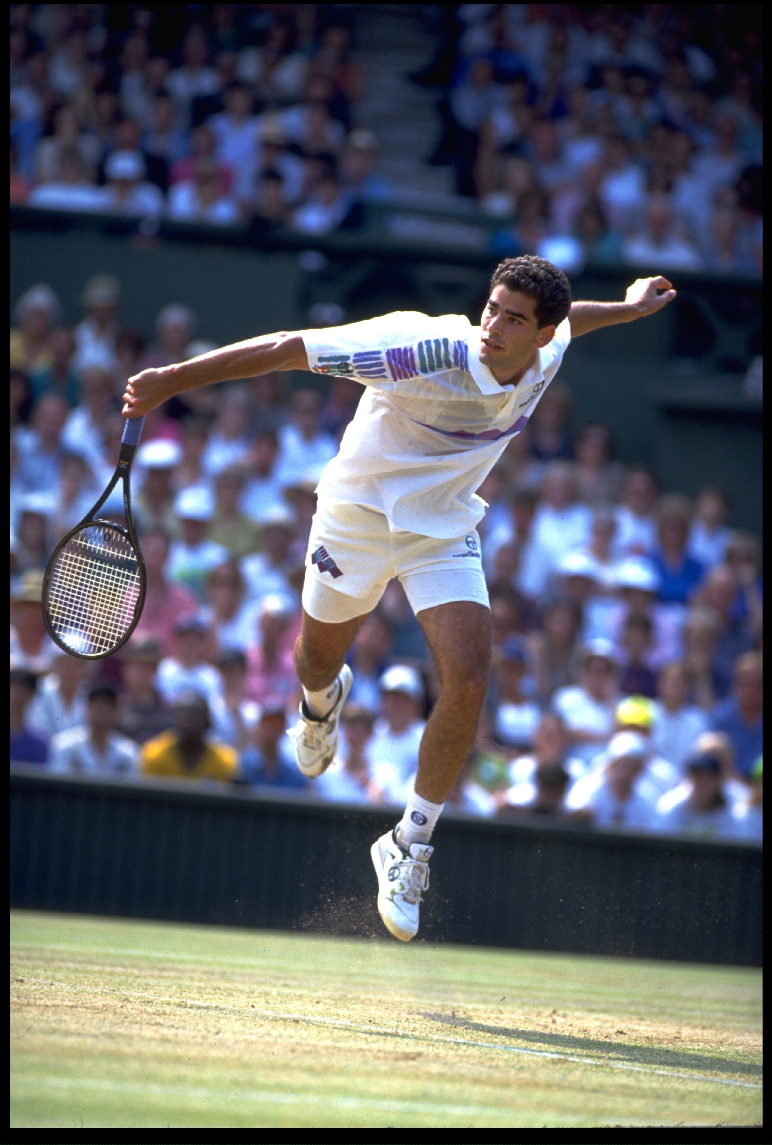 JUN 1993:  PETE SAMPRAS OF THE UNITED STATES PLAYS A SLICE BACKHAND DURING A MATCH AT THE 1993 WIMBLEDON TENNIS CHAMPIONSHIPS.