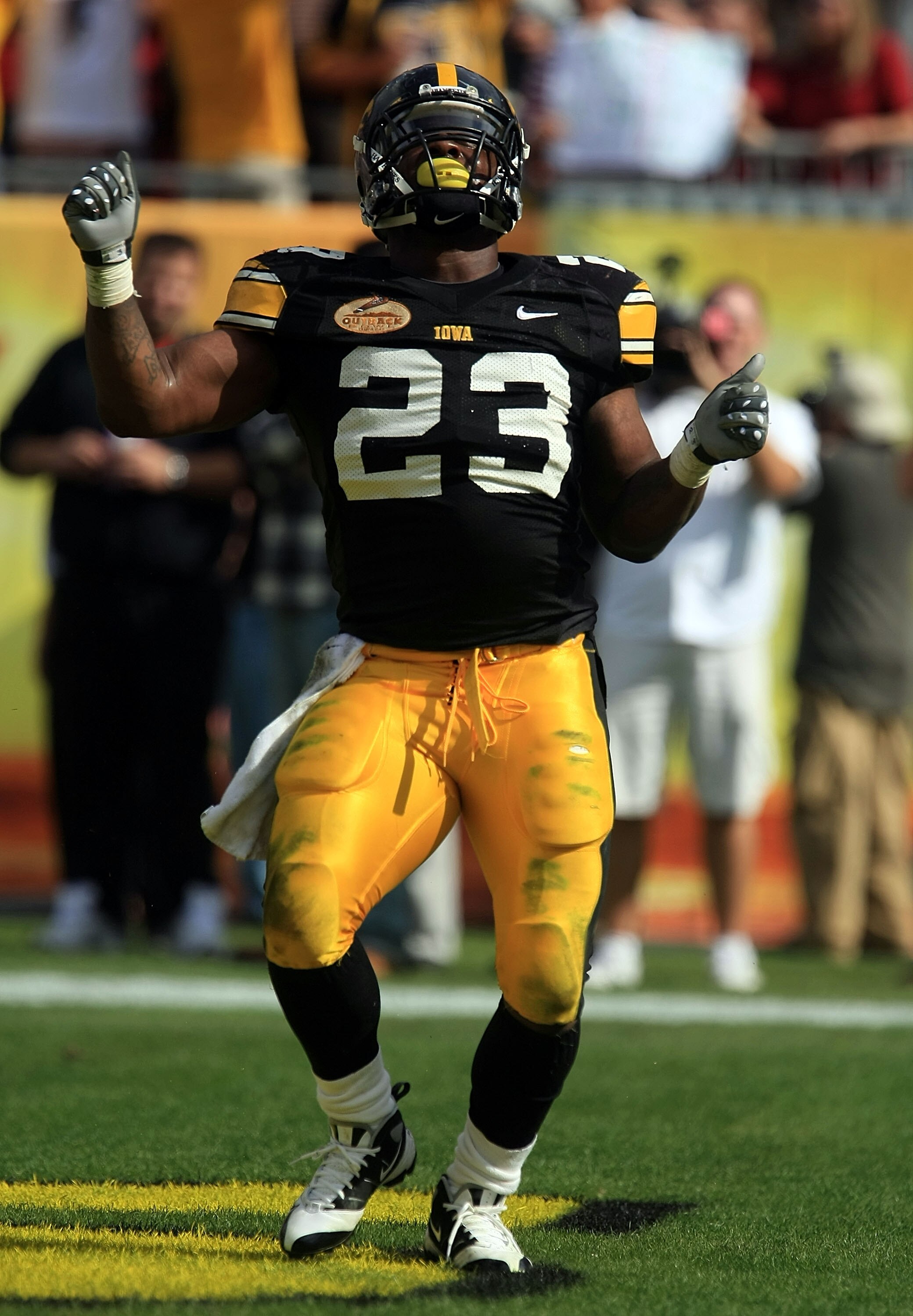 TAMPA, FL - JANUARY 01:  Shonn Green #23 of the Iowa Hawkeyes celebrates a touchdown run against the South Carolina Gamecocks during the Outback Bowl on January 1, 2009 at Raymond James Stadium in Tampa, Florida.  (Photo by Scott Halleran/Getty Images)