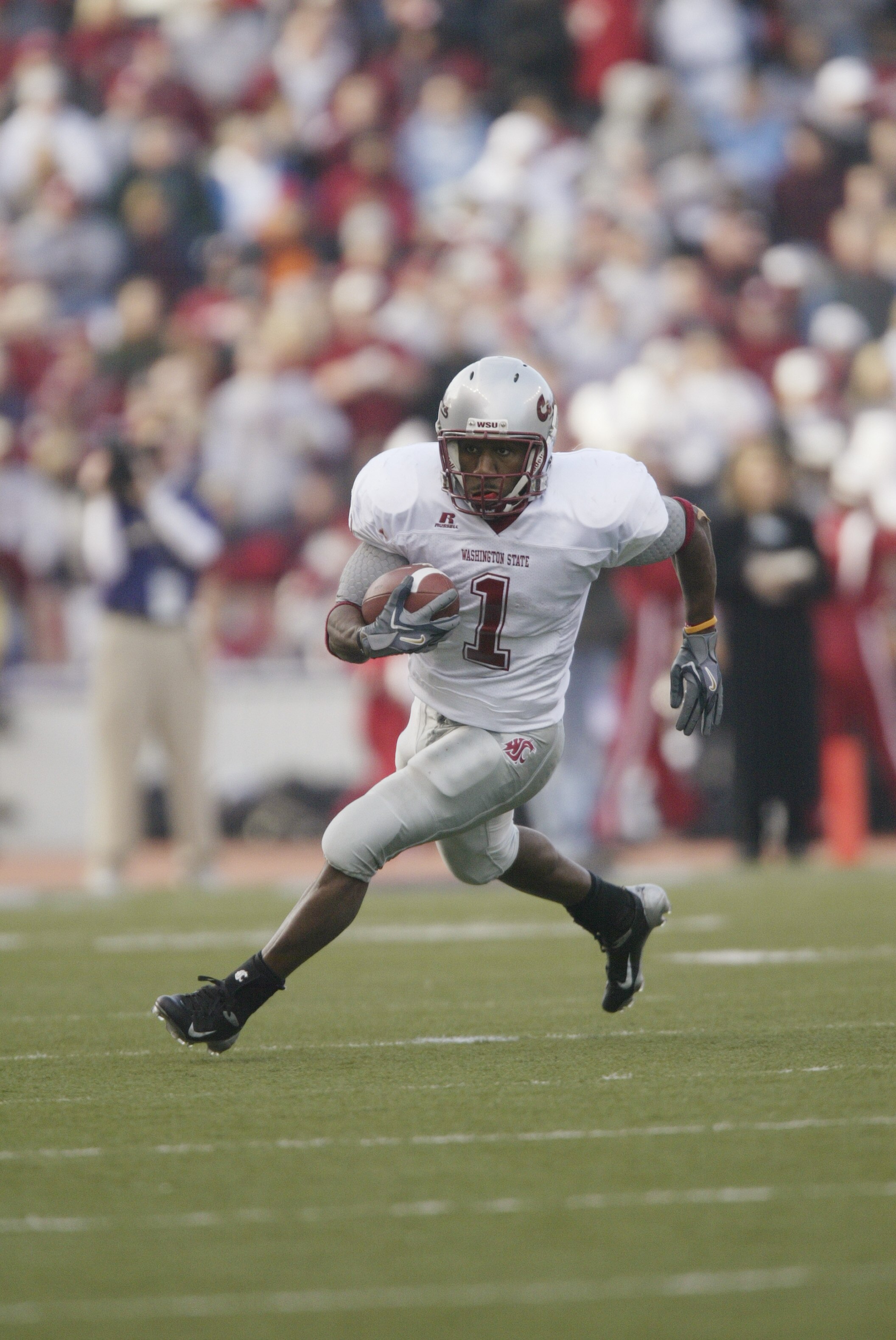 SEATTLE - NOVEMBER 19:  Running back Jerome Harrison #1 of the Washington State Cougars carries the ball against the Washington Huskies at Husky Stadium on November 19, 2005 in Seattle Washington. The Cougars defeated the Huskies 26-22.  (Photo by Otto Gr