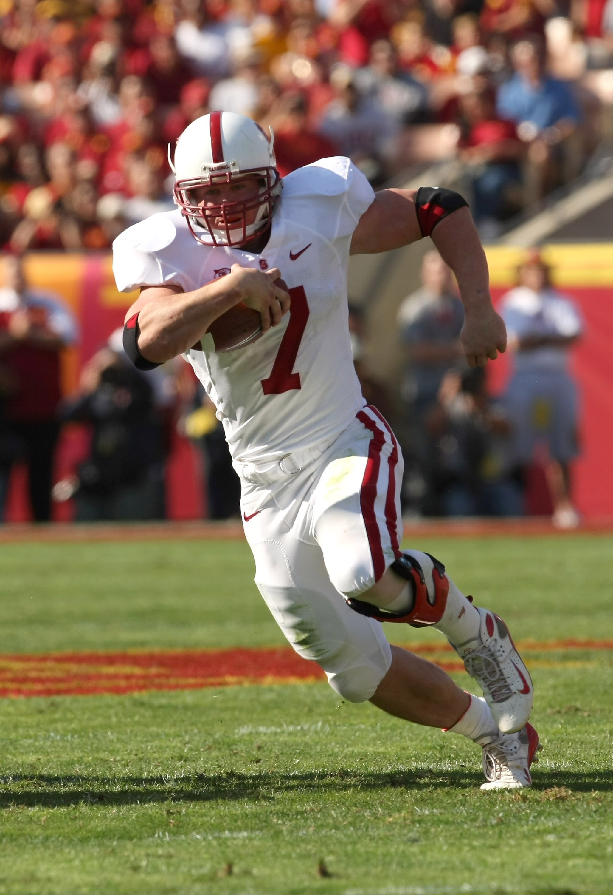 LOS ANGELES, CA - NOVEMBER 14:  Running back Toby Gerharrt #7 of the Stanford Cardinal  carries the ball against the USC Trojans on November 14, 2009 at the Los Angeles Coliseum in Los Angeles, California.  Stanford won 55-21.  (Photo by Stephen Dunn/Gett