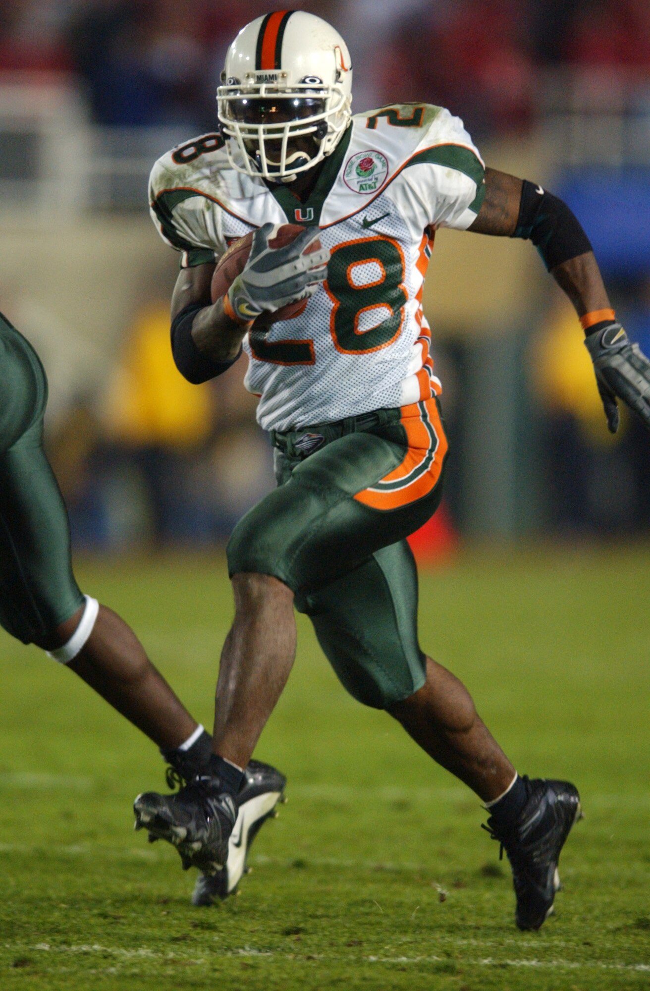 3 Jan 2002:  Clinton Portis #28 of Miami carries the football against the Nebraska defense during the Rose Bowl National Championship game at the Rose Bowl in Pasadena, California.  Miami won the game 37-14, winning the BCS and the National Championship t