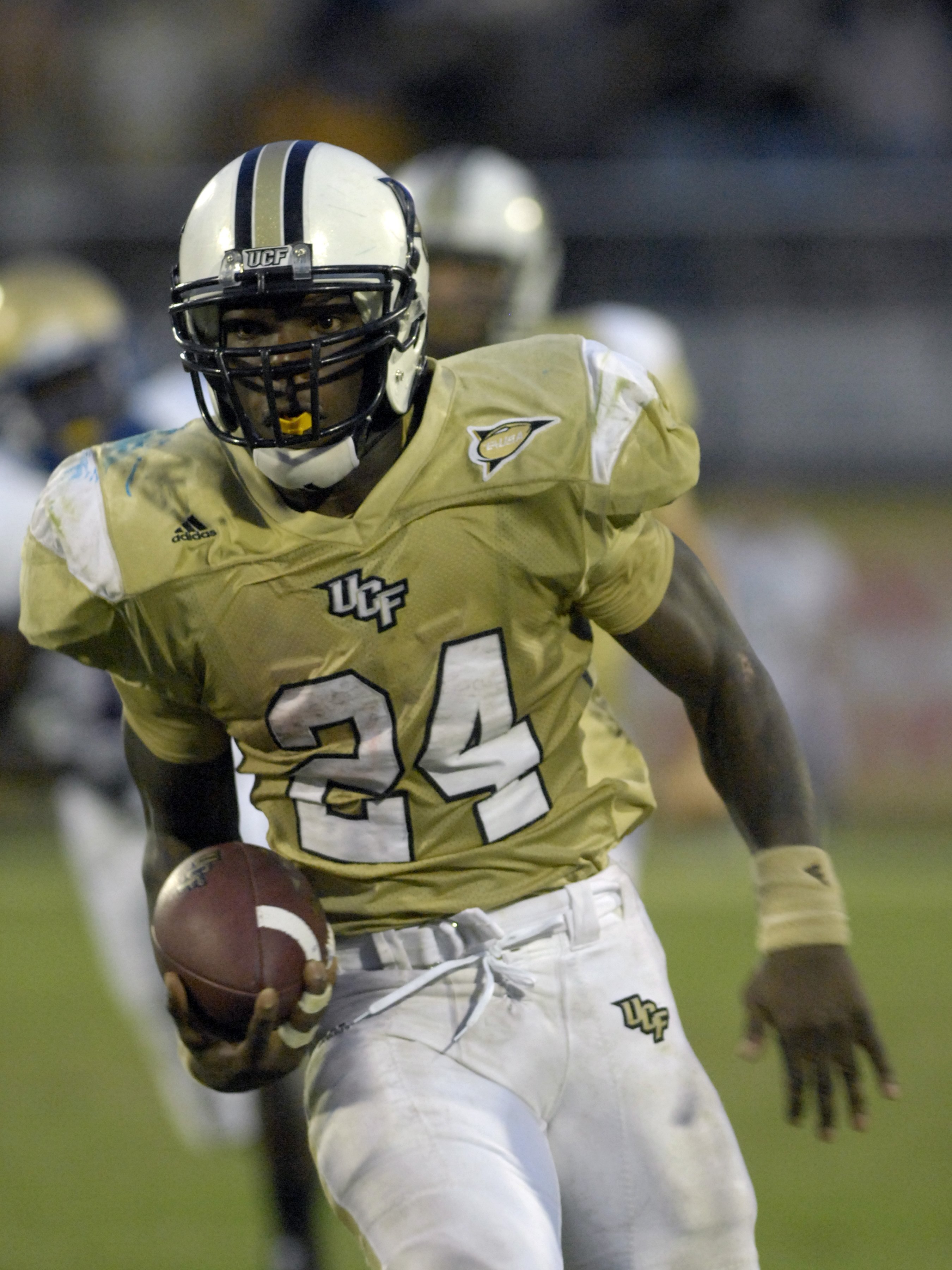 ORLANDO, FL - OCTOBER 20: Tailback Kevin Smith #24 of the University of Central Florida Golden Knights rushes upfield against the Tulsa Golden Hurricane at Bright House Stadium on October 20, 2007 in Orlando, Florida.  UCF won 44 - 23. (Photo by Al Messer