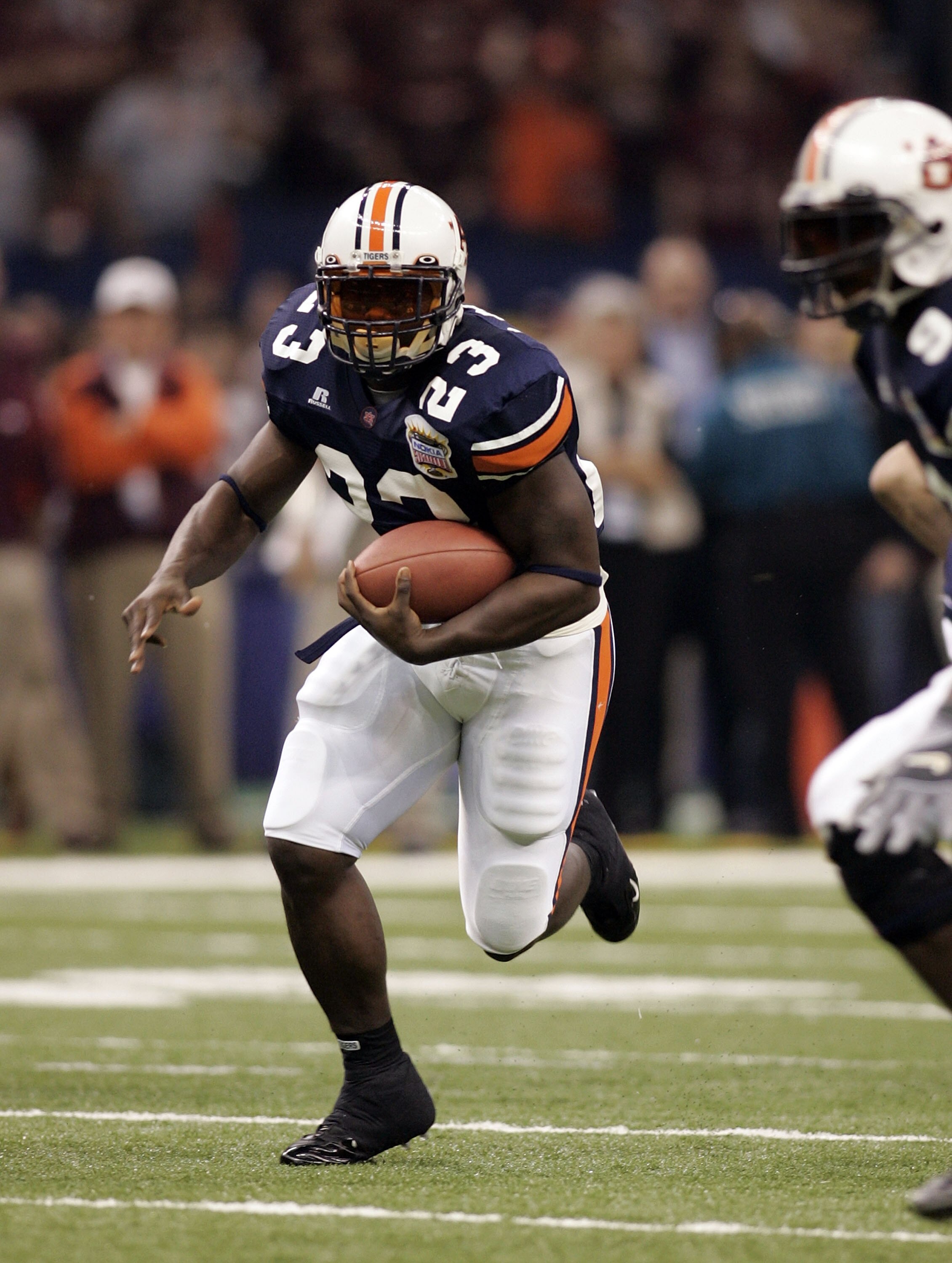 NEW ORLEANS - JANUARY 03:  Running back Ronnie Brown #23 of the Auburn Tigers runs with the ball against the Virginia Tech Hokies during the Nokia Sugar Bowl on January 3, 2005 at the Superdome in New Orleans, Louisiana.  (Photo by Chris Graythen/Getty Im