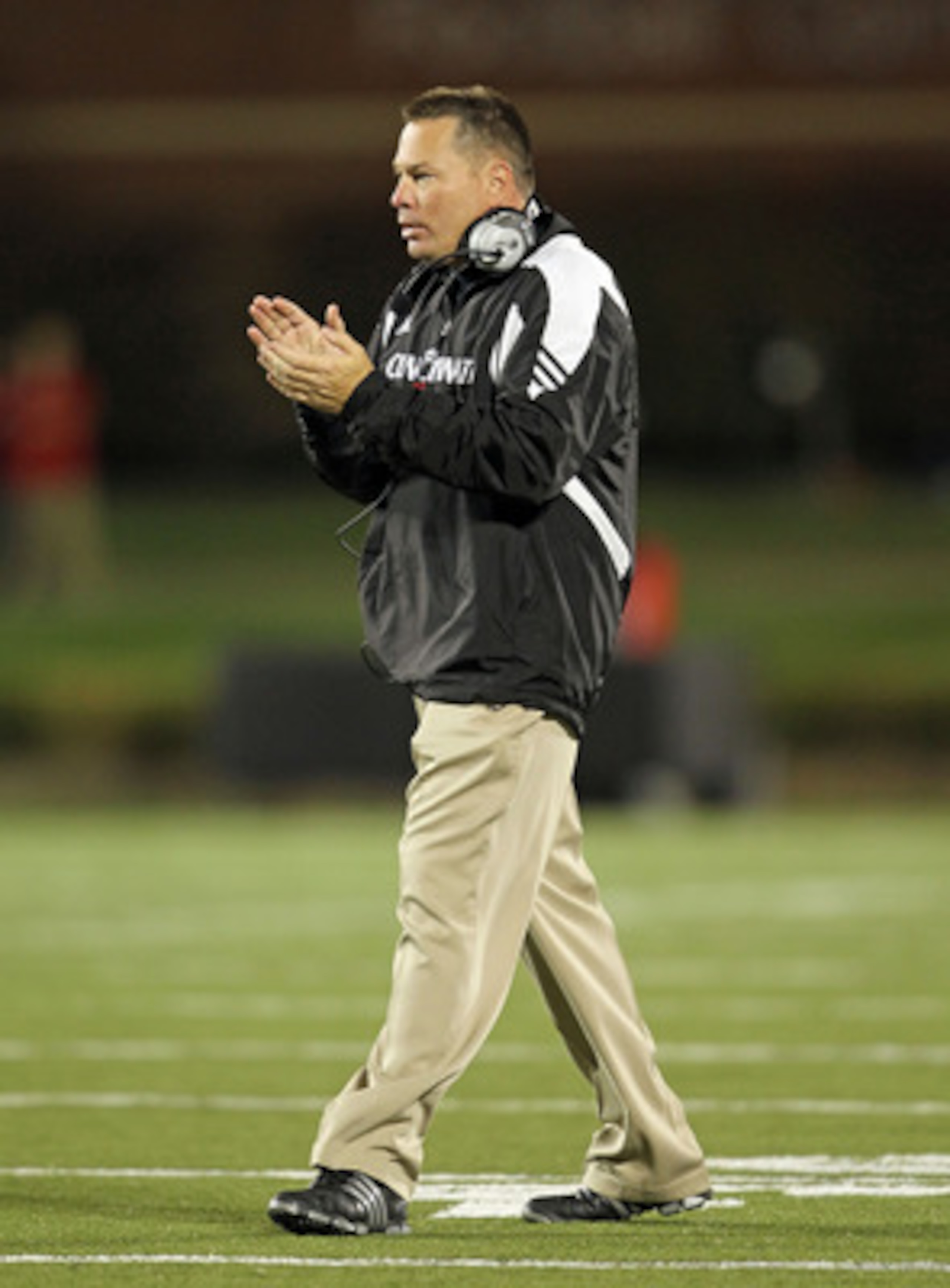 LOUISVILLE, KY - OCTOBER 15: Butch Jones the Head Coach of the Cincinnati Bearcats gives instructions to his team during the Big East Conference game against the Louisville Cardinals at Papa John's Cardinal Stadium on October 15, 2010 in Louisville, Kentu