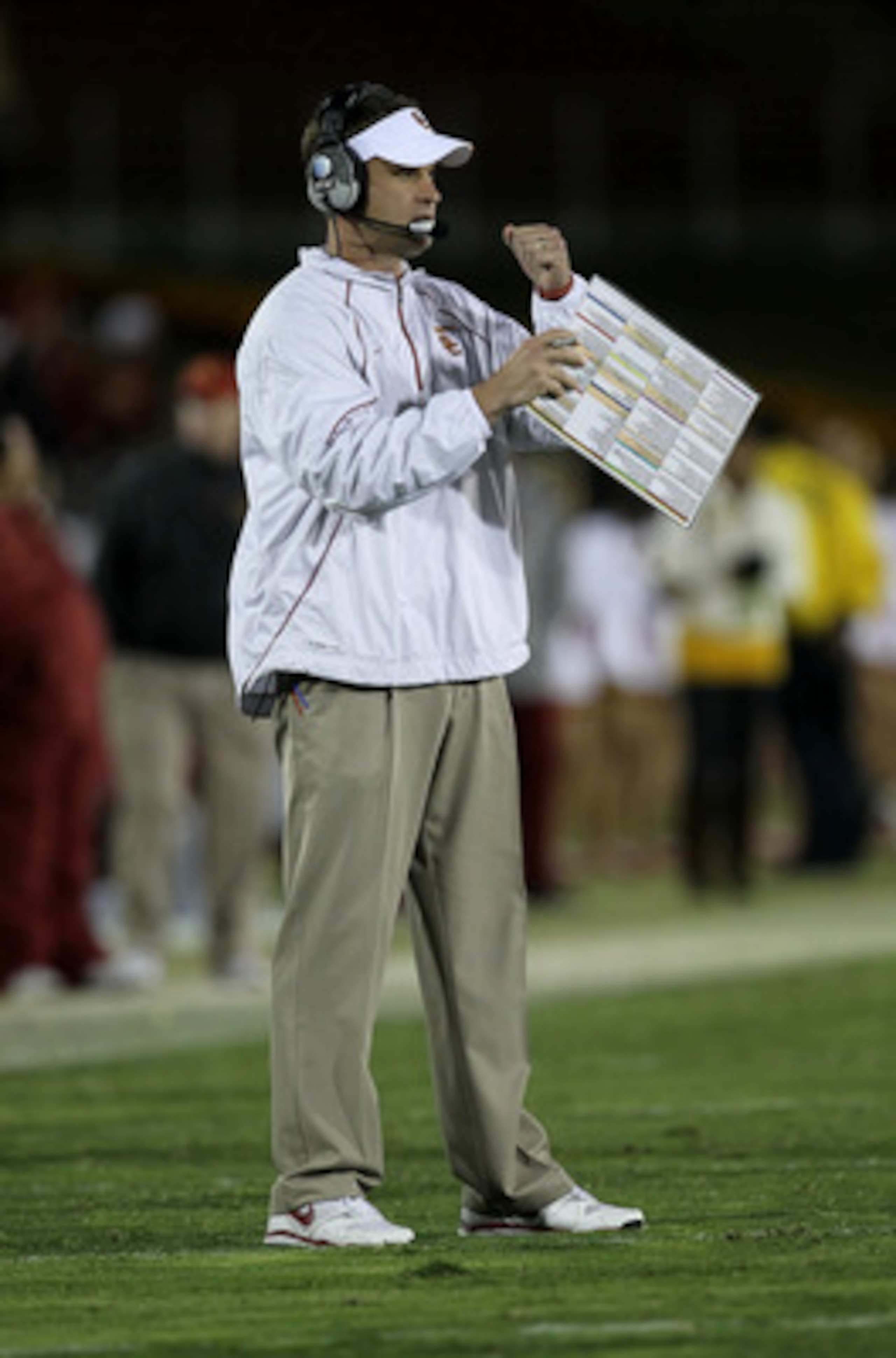 LOS ANGELES - NOVEMBER 27:  Head coach Lane Kiffin of the USC Trojans signals during the game with the Notre Dame Fighting Irish at the Los Angeles Memorial Coliseum on November 27, 2010 in Los Angeles, California.  Notre Dame won 20-16.  (Photo by Stephe