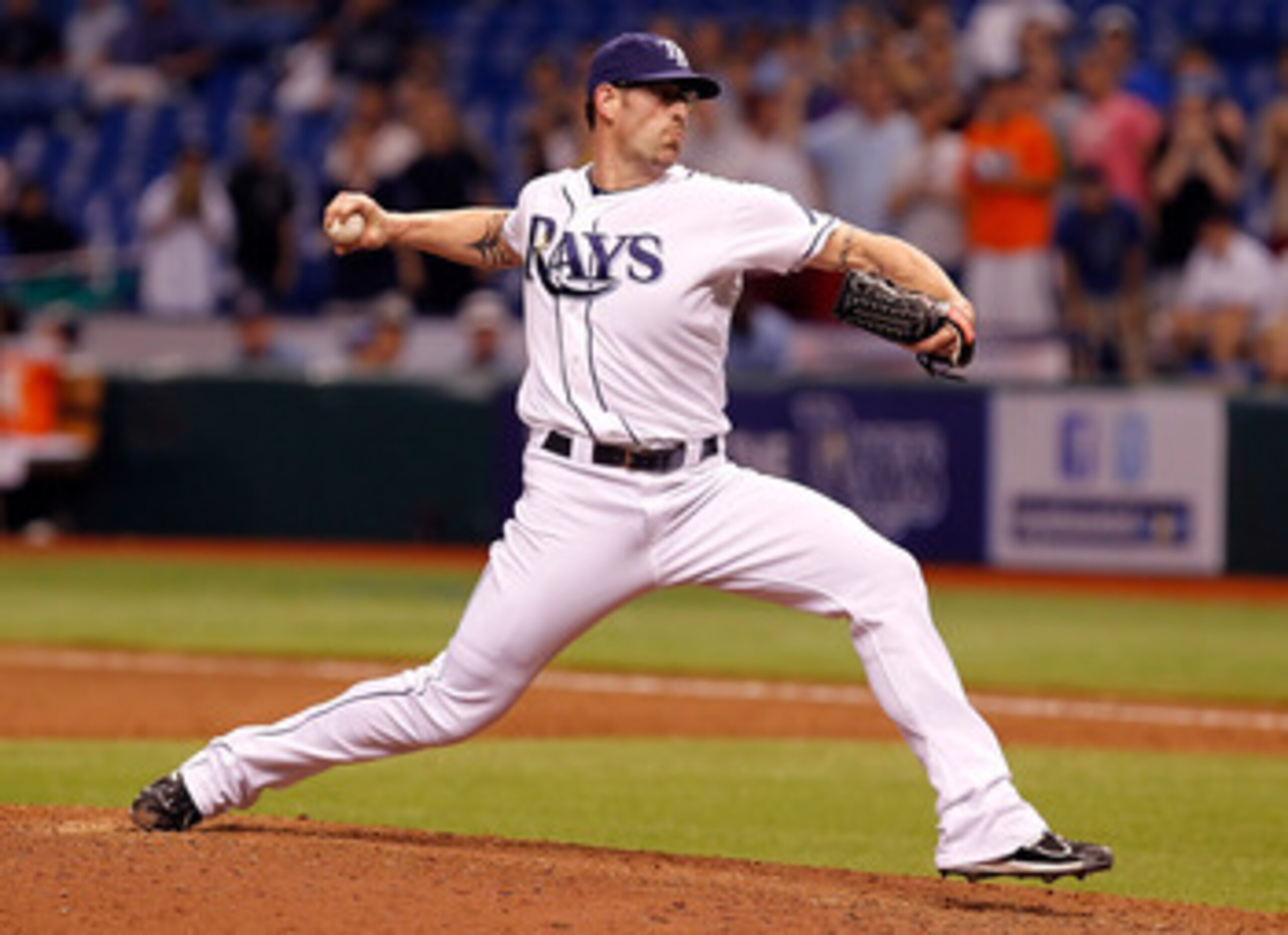 ST. PETERSBURG, FL - MAY 31: Relief pitcher Kyle Farnsworth #43 of the Tampa Bay Rays gets the final three outs for the save against the Texas Rangers during the game at Tropicana Field on May 31, 2011 in St. Petersburg, Florida. (Photo by J. Meric/Gett ST. PETERSBURG, FL - MAY 31: Relief pitcher Kyle Farnsworth #43 of the Tampa Bay Rays gets the final three outs for the save against the Texas Rangers during the game at Tropicana Field on May 31, 2011 in St. Petersburg, Florida. (Photo by J. Meric/Gett