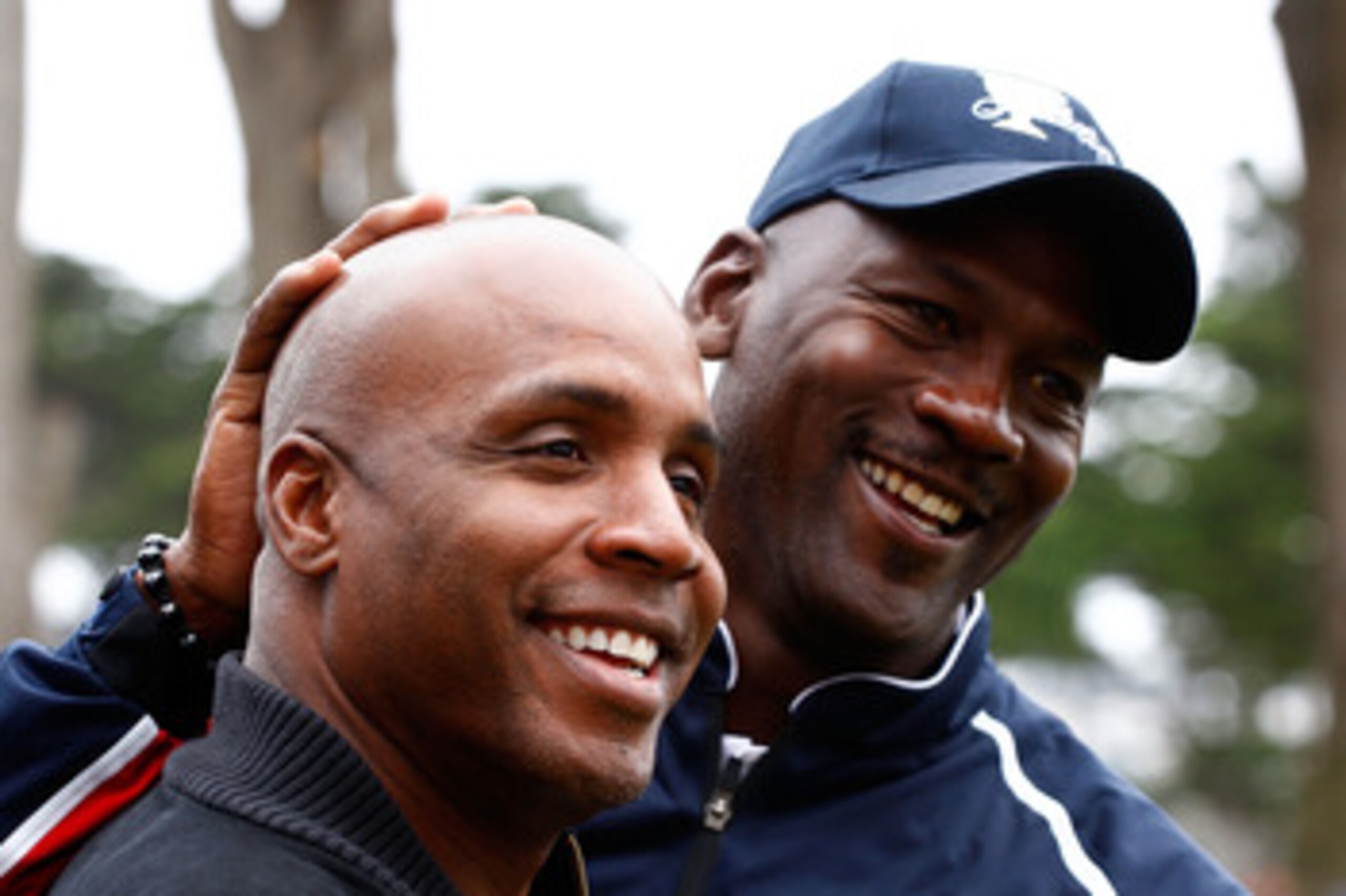 SAN FRANCISCO - OCTOBER 08:  Sports stars Barry Bonds and Michael Jordan clown around on the practice ground during the Day One Foursome Matches of The Presidents Cup at Harding Park Golf Course on October 8, 2009 in San Francisco, California.  (Photo by