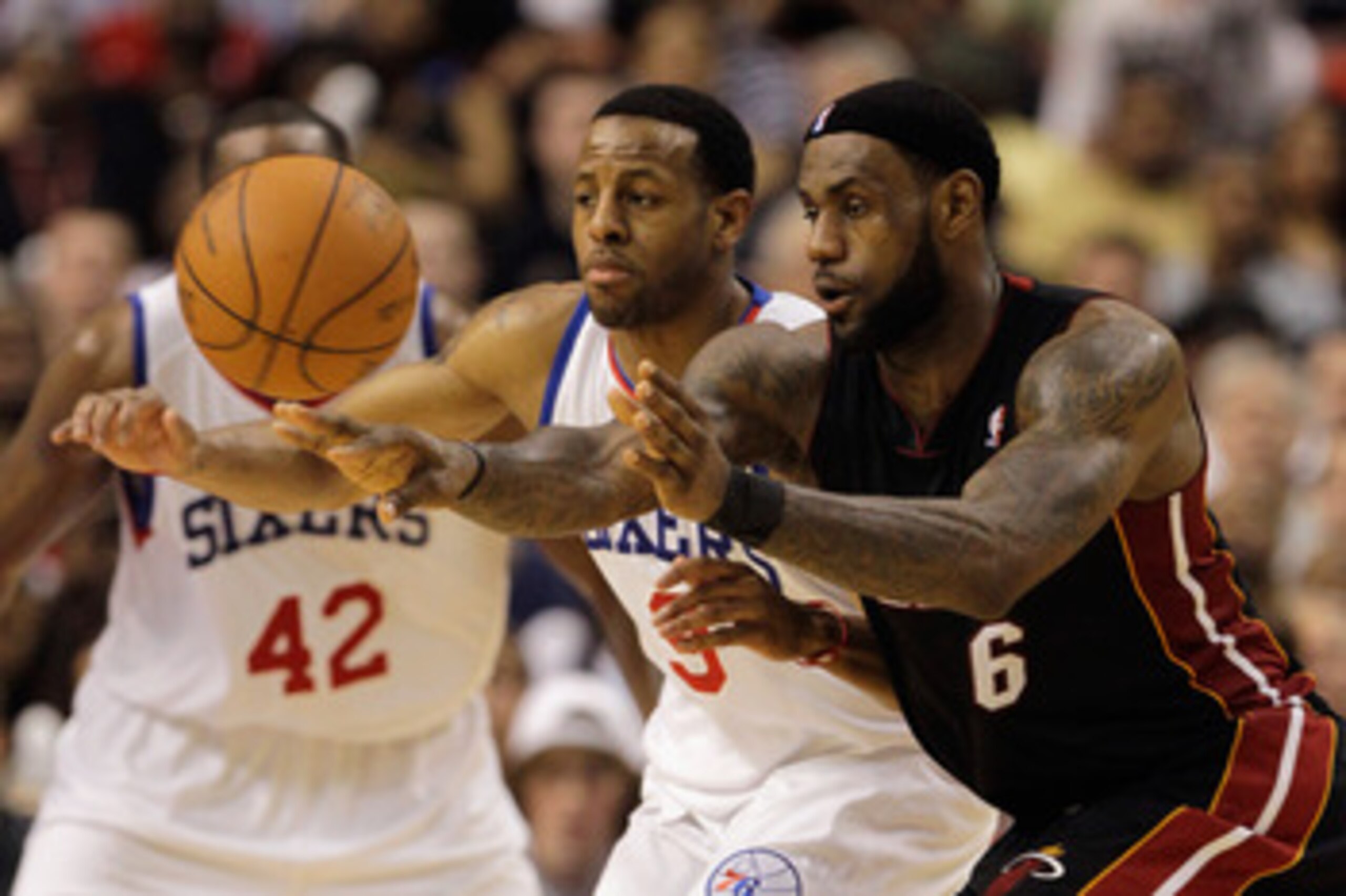 PHILADELPHIA, PA - APRIL 24:  LeBron James #6 of the Miami Heat passes the ball in front of Andre Iguodala #9 of the Philadelphia 76ers during the second half in Game Four of the Eastern Conference Quarterfinals in the 2011 NBA Playoffs at Wells Fargo Cen