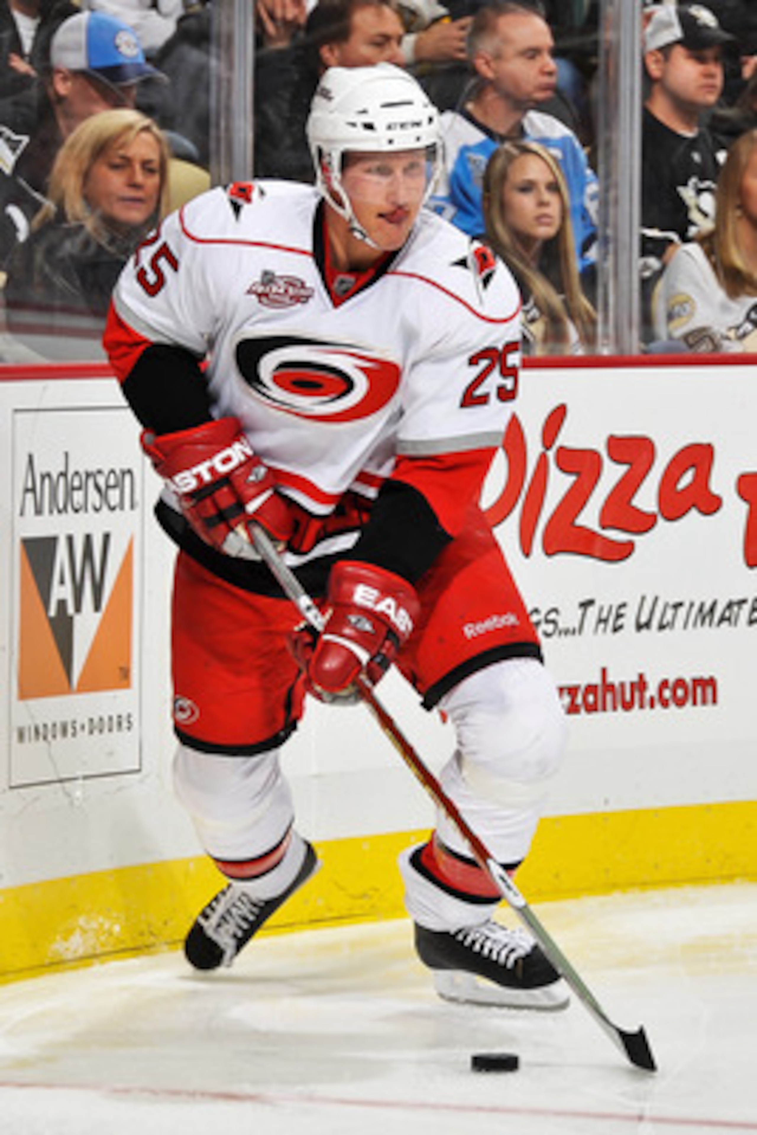 PITTSBURGH - NOVEMBER 19:  Joni Pitkanen #25 of the Carolina Hurricanes skates with the puck against the Pittsburgh Penguins on November 19, 2010 at Consol Energy Center in Pittsburgh, Pennsylvania.  (Photo by Jamie Sabau/Getty Images)