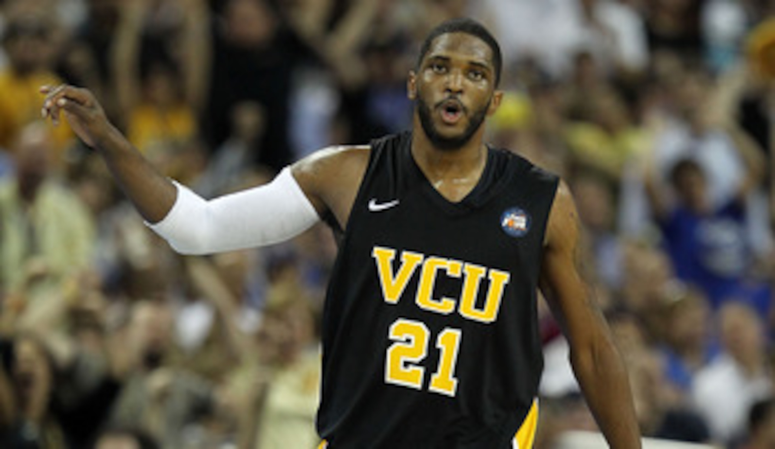 HOUSTON, TX - APRIL 02:  Jamie Skeen #21 of the Virginia Commonwealth Rams reacts after hitting a three pointer and drawing a foul against the Butler Bulldogs during the National Semifinal game of the 2011 NCAA Division I Men's Basketball Championship at