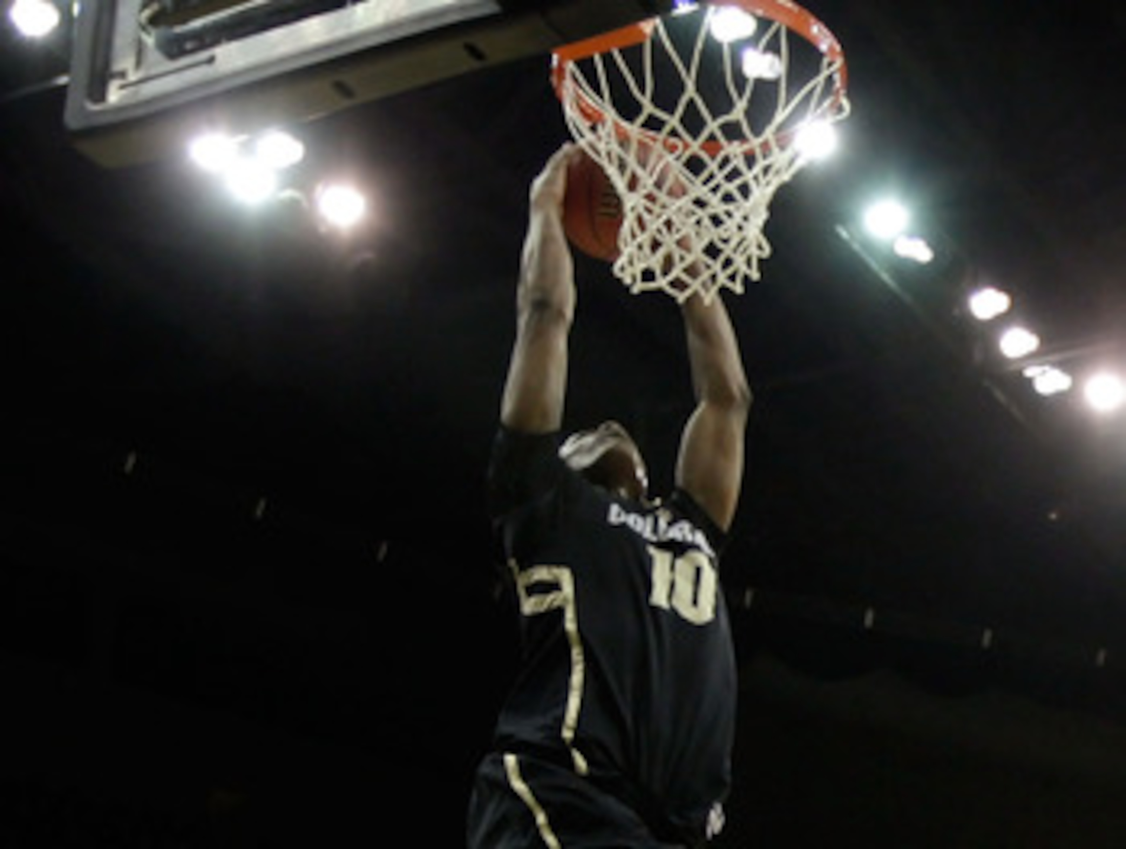 KANSAS CITY, MO - MARCH 11:  Alec Burks #10 of the Colorado Buffaloes dunks the ball against the Kansas Jayhawks during their semifinal game in the 2011 Phillips 66 Big 12 Men's Basketball Tournament at Sprint Center on March 11, 2011 in Kansas City, Miss