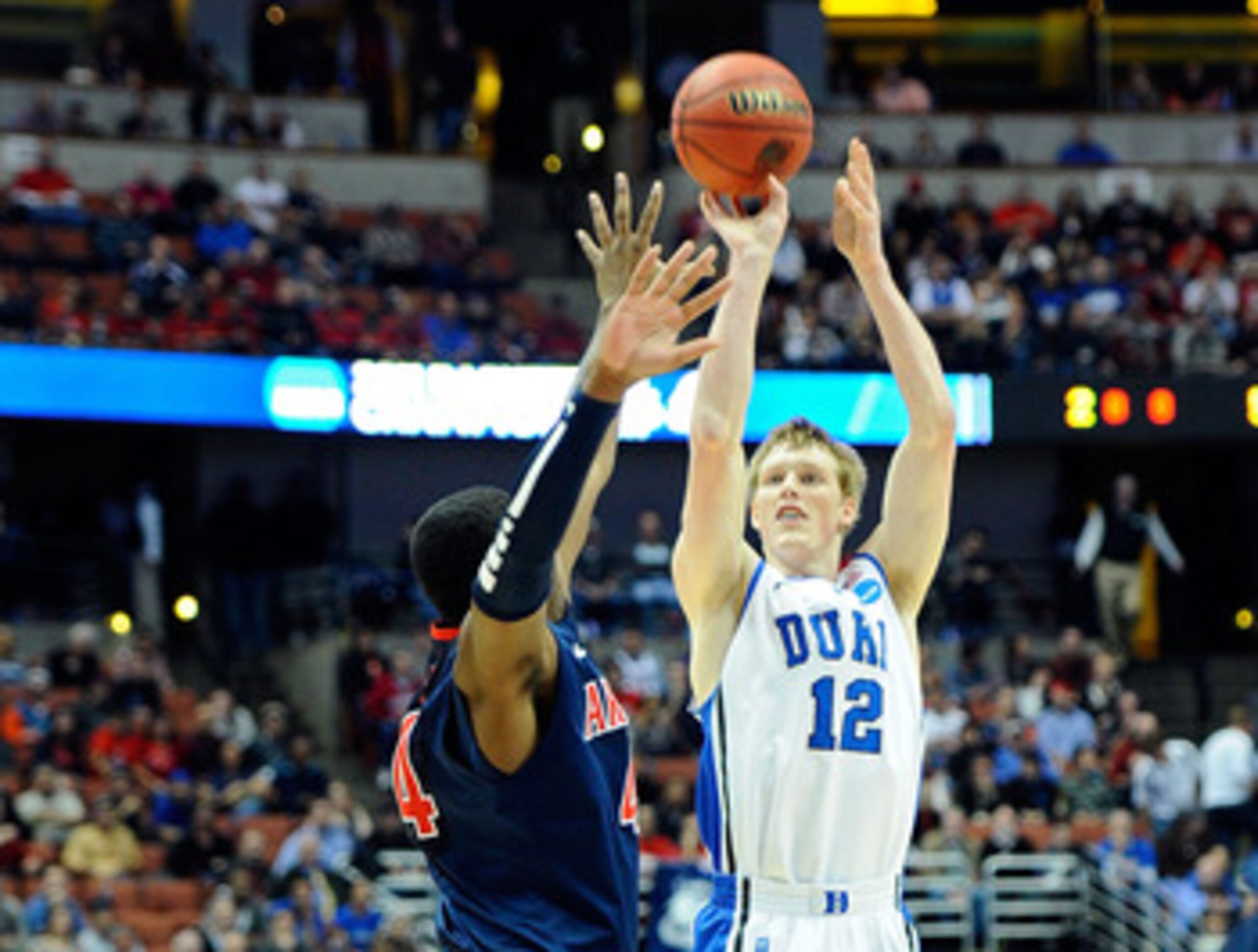 ANAHEIM, CA - MARCH 24:  Kyle Singler #12 of the Duke Blue Devils shoot the ball over Solomon Hill #44 of the Arizona Wildcats during the west regional semifinal of the 2011 NCAA men's basketball tournament at the Honda Center on March 24, 2011 in Anaheim