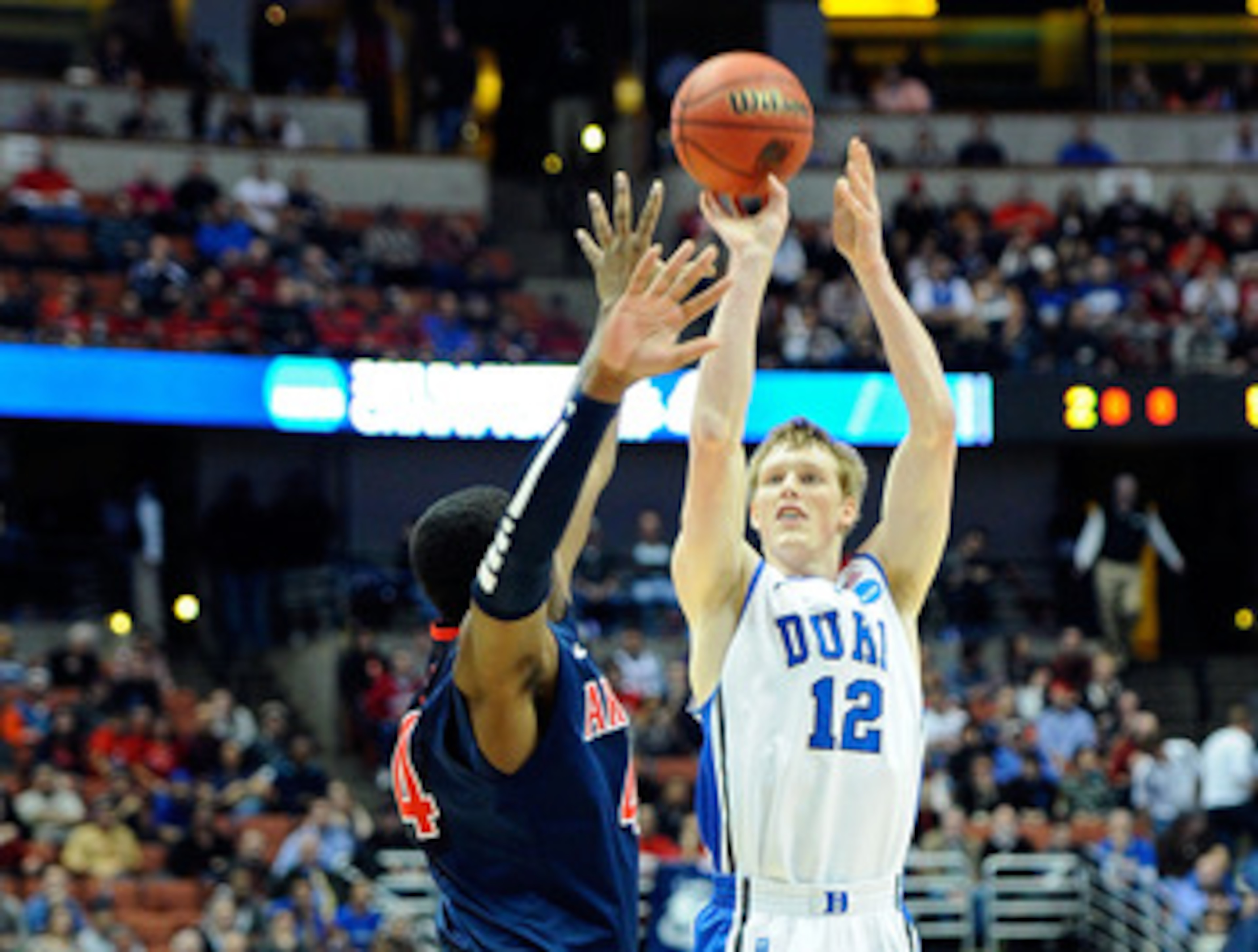 ANAHEIM, CA - MARCH 24:  Kyle Singler #12 of the Duke Blue Devils shoot the ball over Solomon Hill #44 of the Arizona Wildcats during the west regional semifinal of the 2011 NCAA men's basketball tournament at the Honda Center on March 24, 2011 in Anaheim