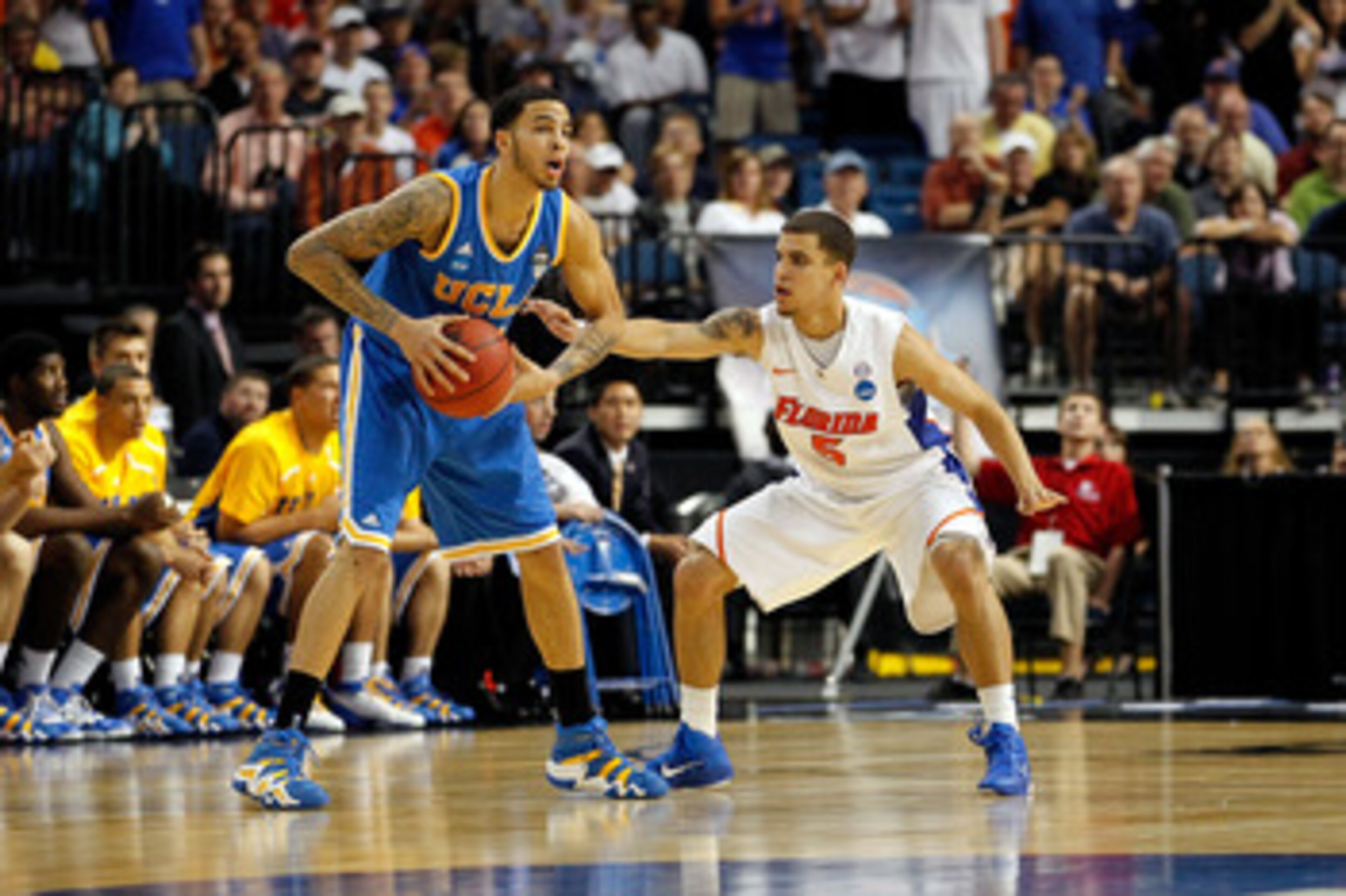 TAMPA, FL - MARCH 19:  Tyler Honeycutt #23 of the UCLA Bruins looks to pass against Scottie Wilbekin #5 of the Florida Gators during the third round of the 2011 NCAA men's basketball tournament at St. Pete Times Forum on March 19, 2011 in Tampa, Florida.