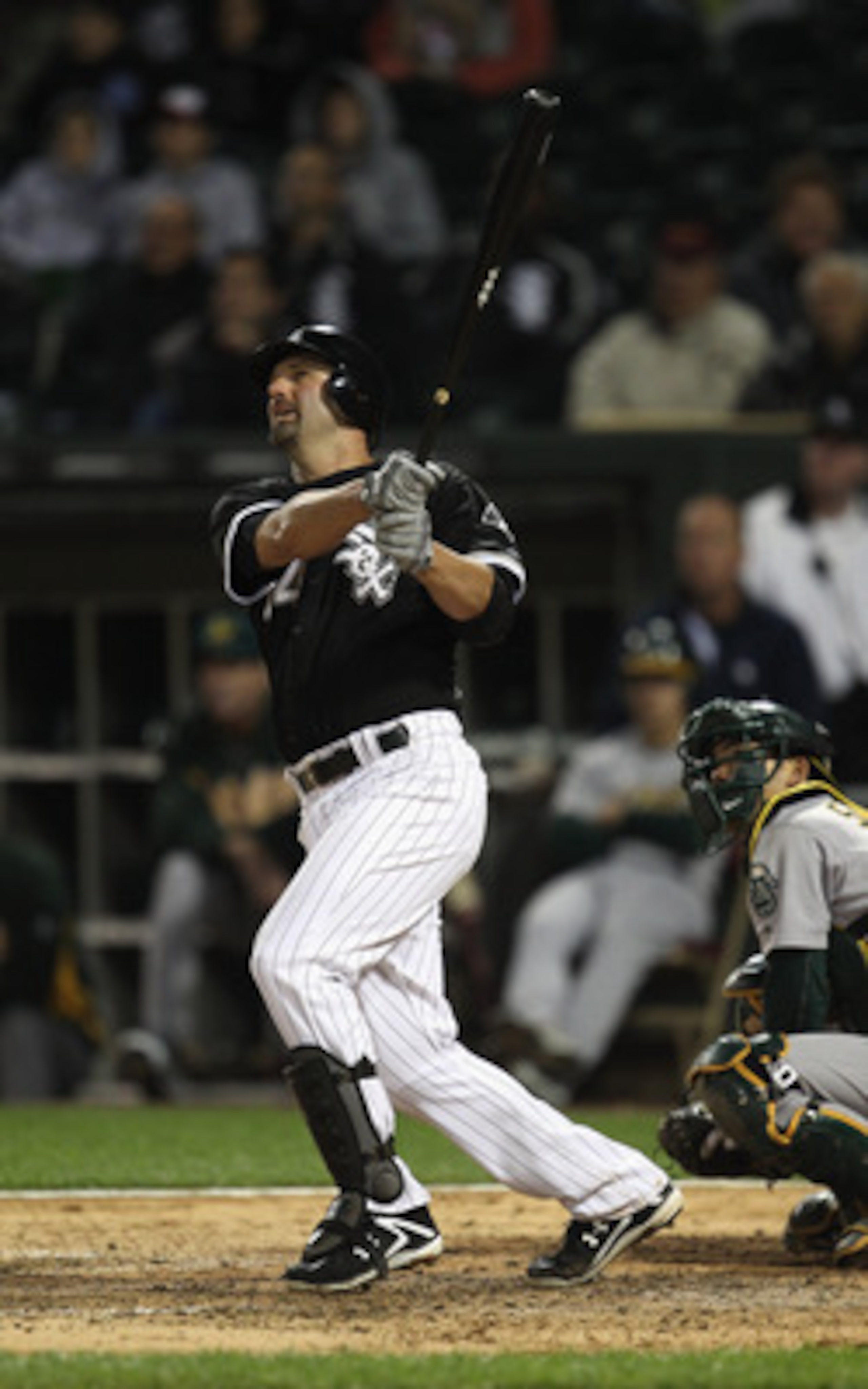 CHICAGO, IL - JUNE 09: Paul Konerko #14 of the Chicago White Sox hits a two-run home run in the 8th inning against the Oakland Athletics at U.S. Cellular Field on June 9, 2011 in Chicago, Illinois. (Photo by Jonathan Daniel/Getty Images)