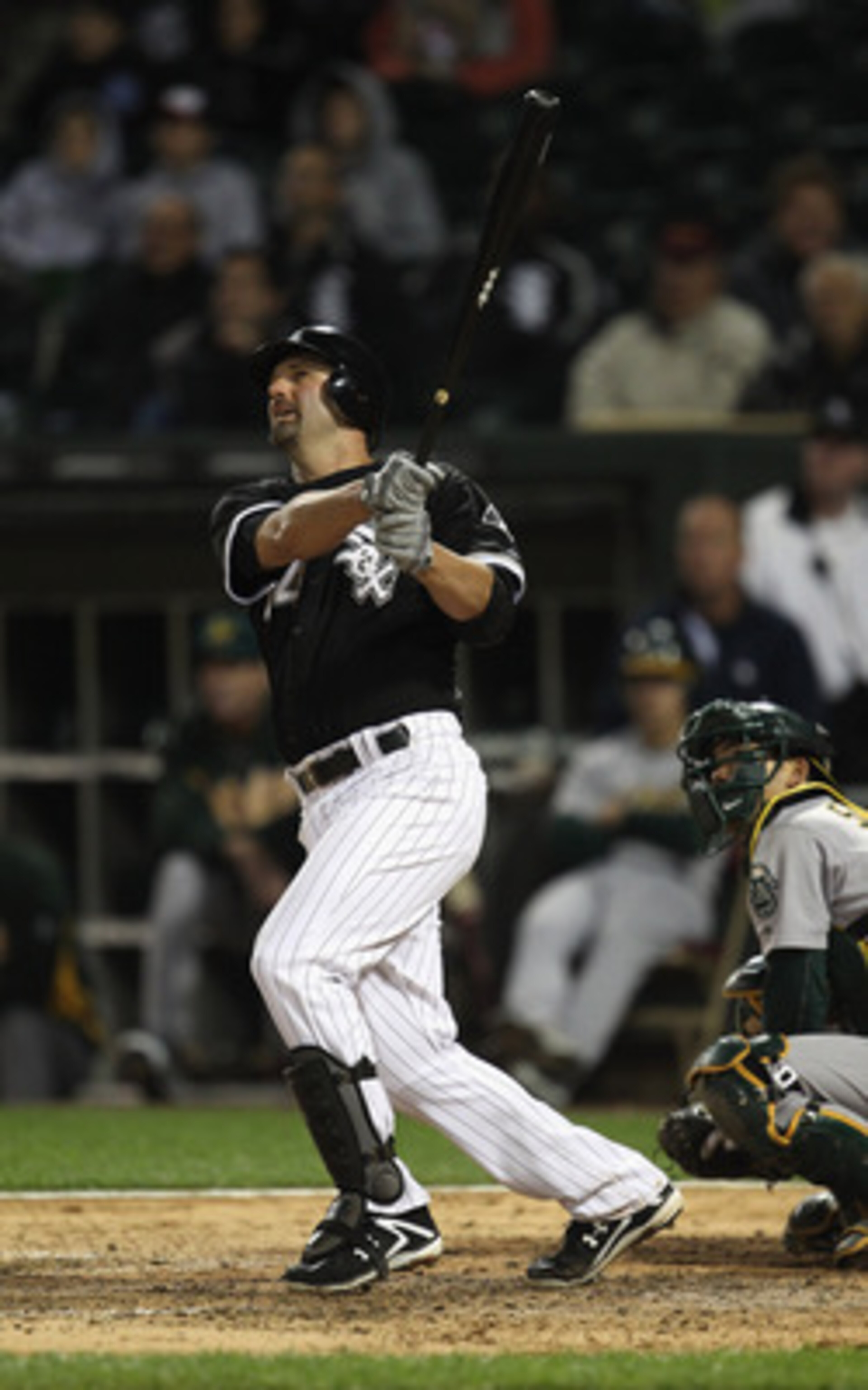 CHICAGO, IL - JUNE 09: Paul Konerko #14 of the Chicago White Sox hits a two-run home run in the 8th inning against the Oakland Athletics at U.S. Cellular Field on June 9, 2011 in Chicago, Illinois. (Photo by Jonathan Daniel/Getty Images) CHICAGO, IL - JUNE 09: Paul Konerko #14 of the Chicago White Sox hits a two-run home run in the 8th inning against the Oakland Athletics at U.S. Cellular Field on June 9, 2011 in Chicago, Illinois. (Photo by Jonathan Daniel/Getty Images)