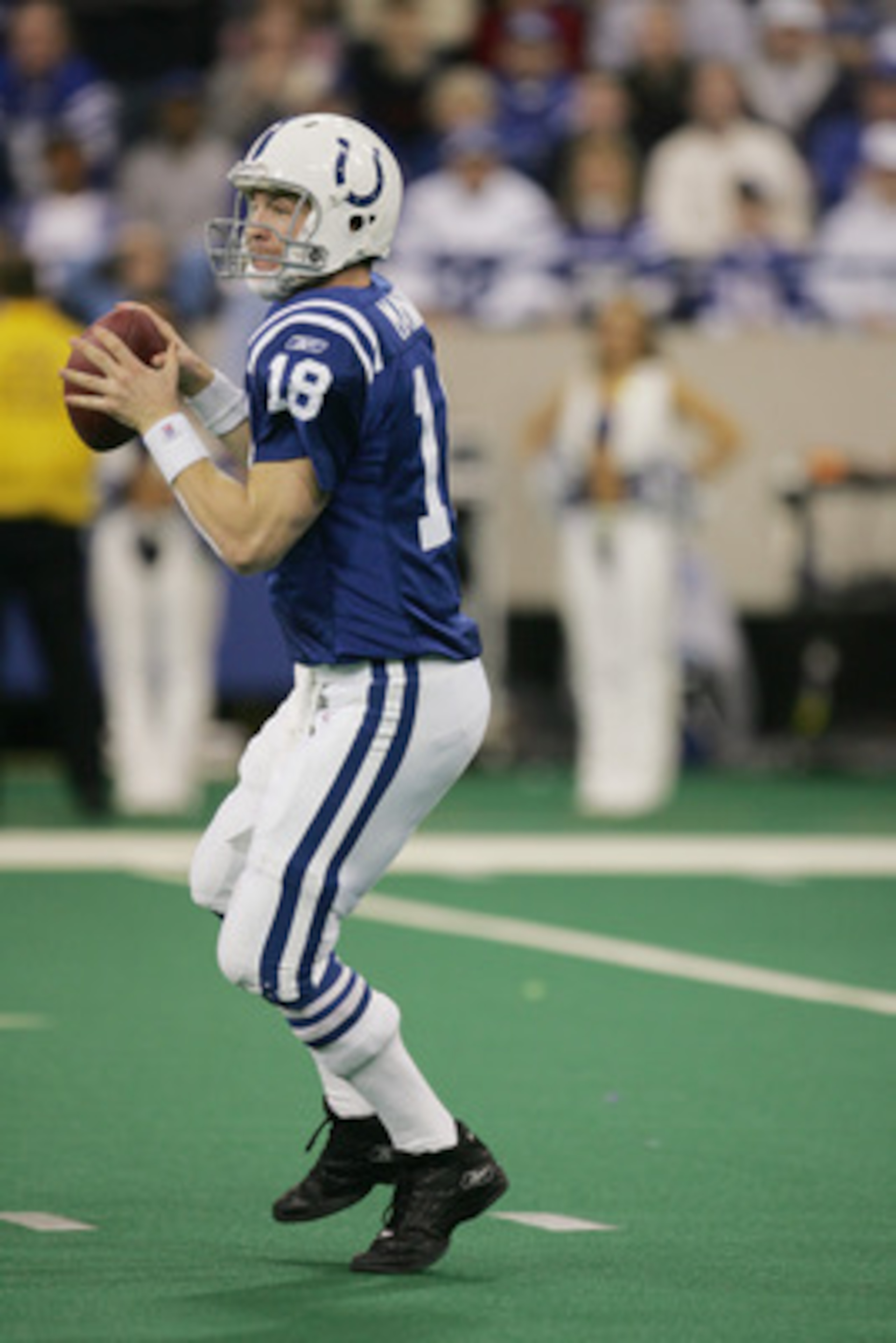 INDIANAPOLIS - DECEMBER 26:  Peyton Manning #18 of the Indianapolis Colts looks to pass against the San Diego Chargers on December 26, 2004 at the RCA Dome in Indianapolis, Indiana.  Peyton Manning passed Dan Marino as he threw his NFL regular season reco
