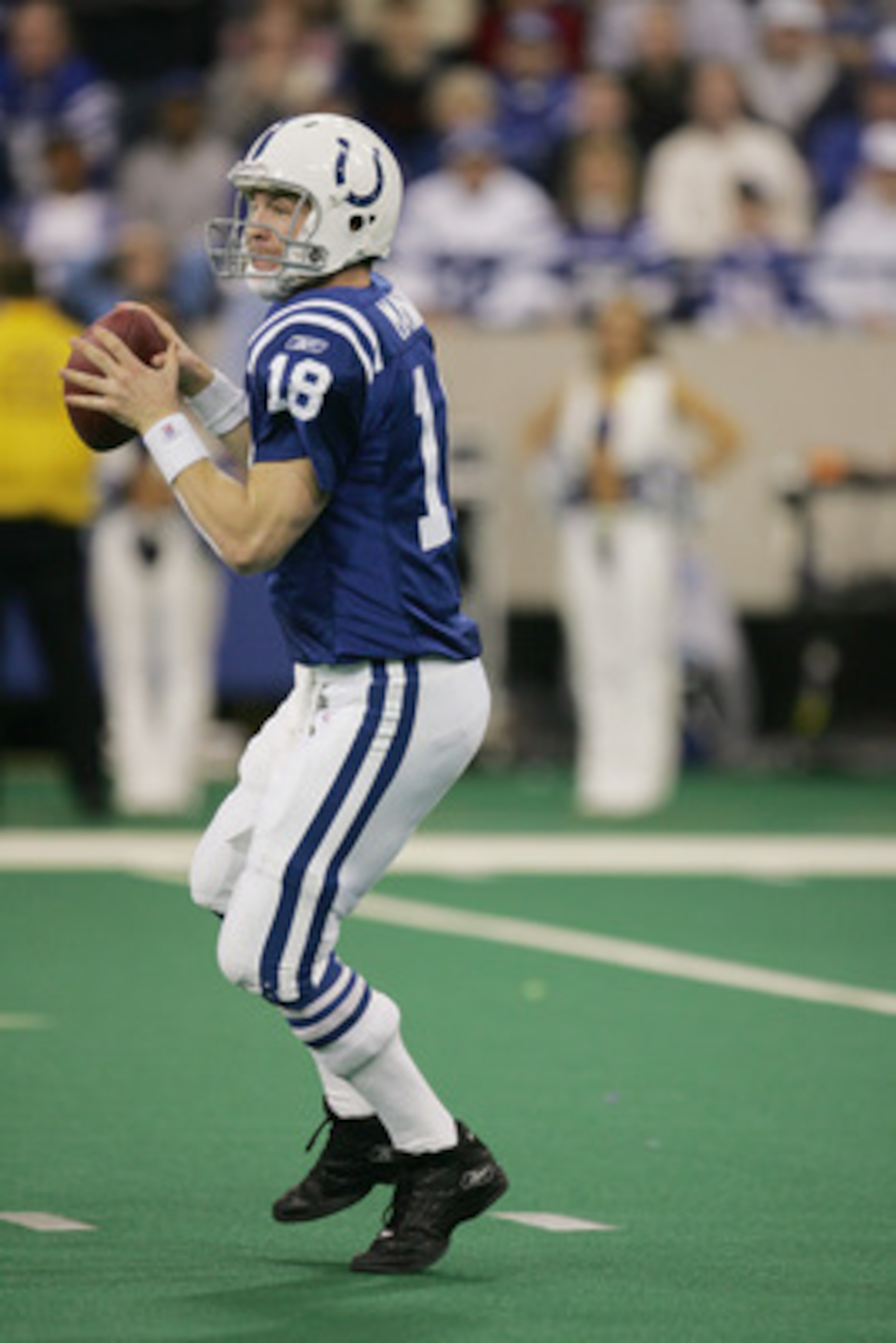 INDIANAPOLIS - DECEMBER 26:  Peyton Manning #18 of the Indianapolis Colts looks to pass against the San Diego Chargers on December 26, 2004 at the RCA Dome in Indianapolis, Indiana.  Peyton Manning passed Dan Marino as he threw his NFL regular season reco