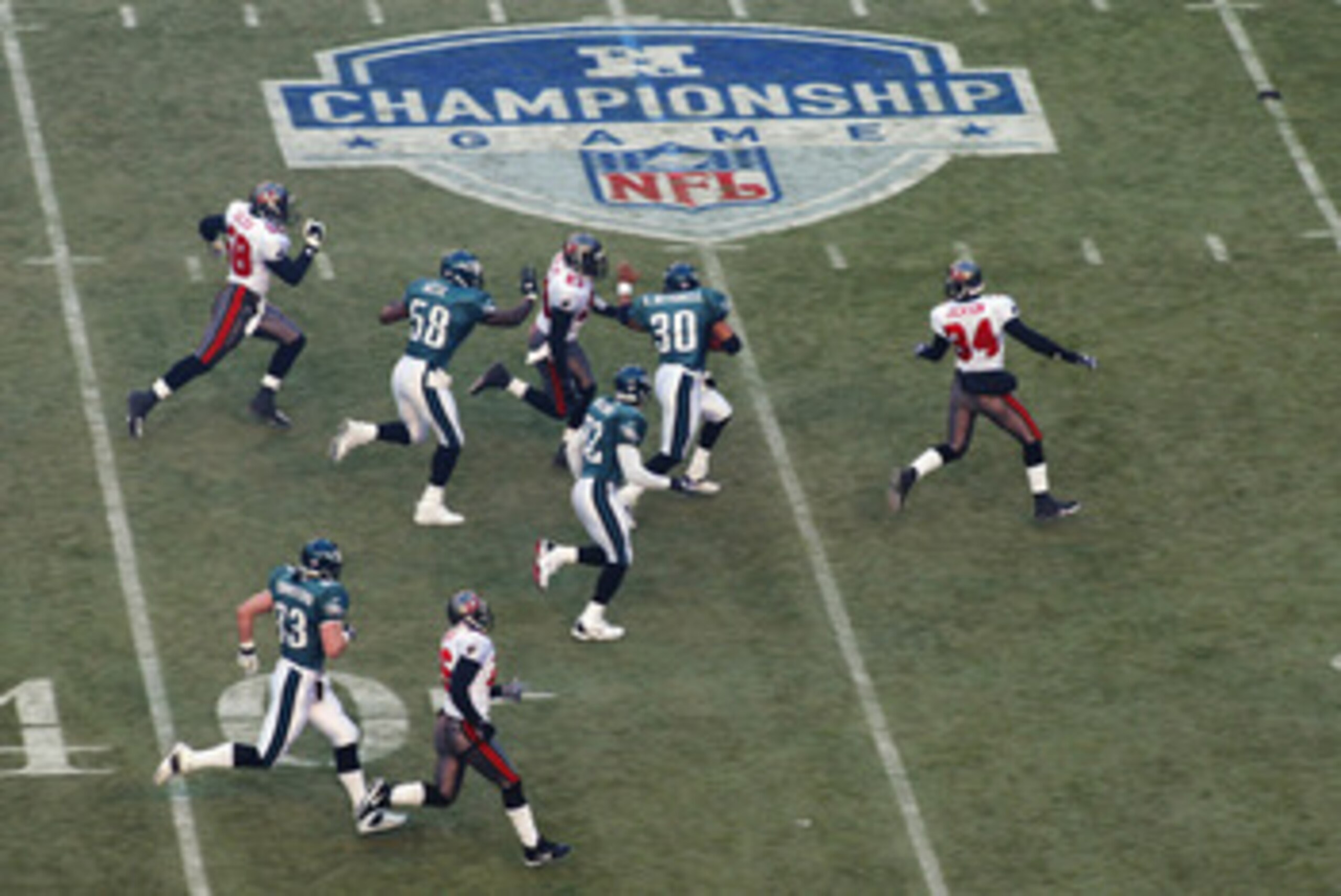 PHILADELPHIA - JANUARY 19:  Brian Mitchell #30 of the Philadelphia Eagles returns the opening kickoff 70 yards against the Tampa Bay Buccanneers in the NFC Championship game at Veterans Stadium on January 19, 2003 in Philadelphia, Pennsylvania. The Buccan