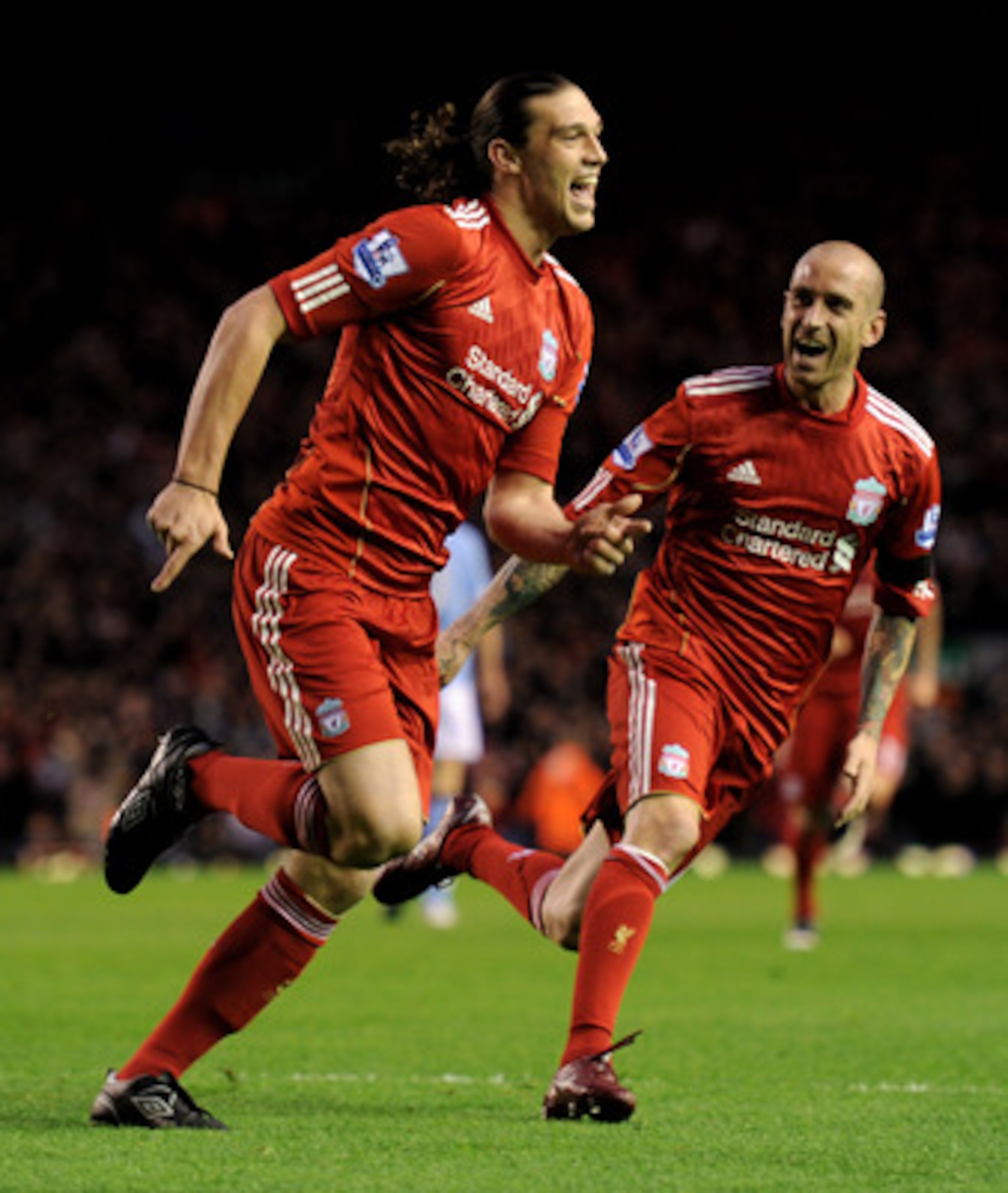 LIVERPOOL, ENGLAND - APRIL 11: Andy Carroll of Liverpool celebrates scoring the opening goal with team mate Raul Meireles (R) during the Barclays Premier League match between Liverpool and Manchester City at Anfield on April 11, 2011 in Liverpool, Englan LIVERPOOL, ENGLAND - APRIL 11: Andy Carroll of Liverpool celebrates scoring the opening goal with team mate Raul Meireles (R) during the Barclays Premier League match between Liverpool and Manchester City at Anfield on April 11, 2011 in Liverpool, Englan