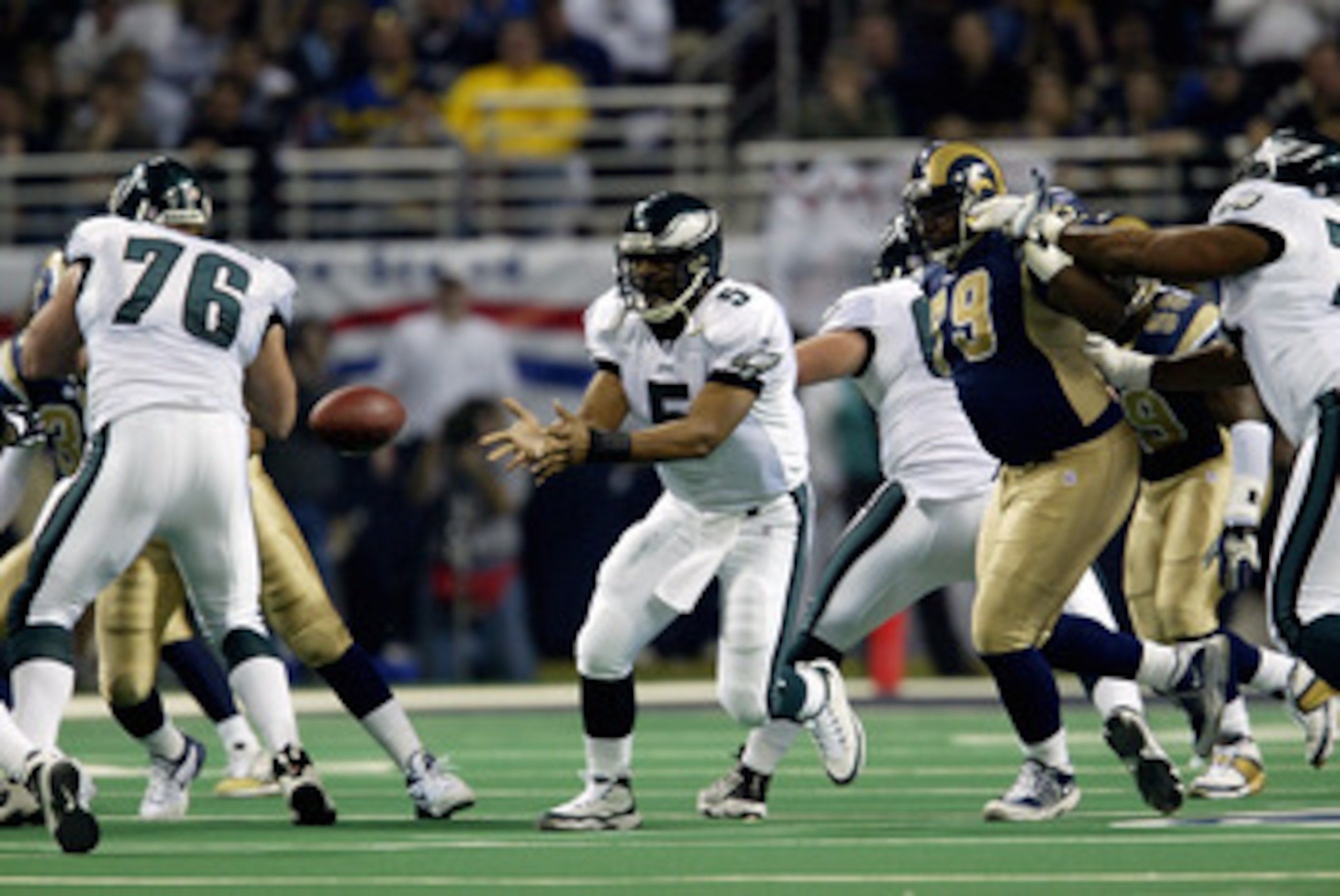 27 Jan 2002: Quarteback Donovan McNabb of the Philadelphia Eagles receives a pass during the NFC Championship Game against the St.Louis Rams at the Dome at  America's Center in St.Louis, Missouri. The Rams advance to the Superbowl after winning 29-24. DIG