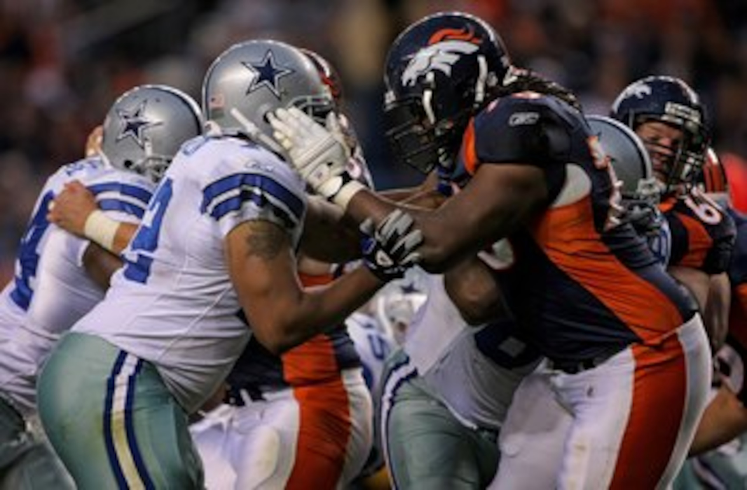 DENVER - AUGUST 16: Offensive tackle Ryan Clady #78 of the Denver Broncos blocks defensive end Stephen Bowen #72 of the Dallas Cowboys during preseason NFL action at Invesco Field at Mile High on August 16, 2008 in Denver, Colorado. The Broncos defeated DENVER - AUGUST 16: Offensive tackle Ryan Clady #78 of the Denver Broncos blocks defensive end Stephen Bowen #72 of the Dallas Cowboys during preseason NFL action at Invesco Field at Mile High on August 16, 2008 in Denver, Colorado. The Broncos defeated