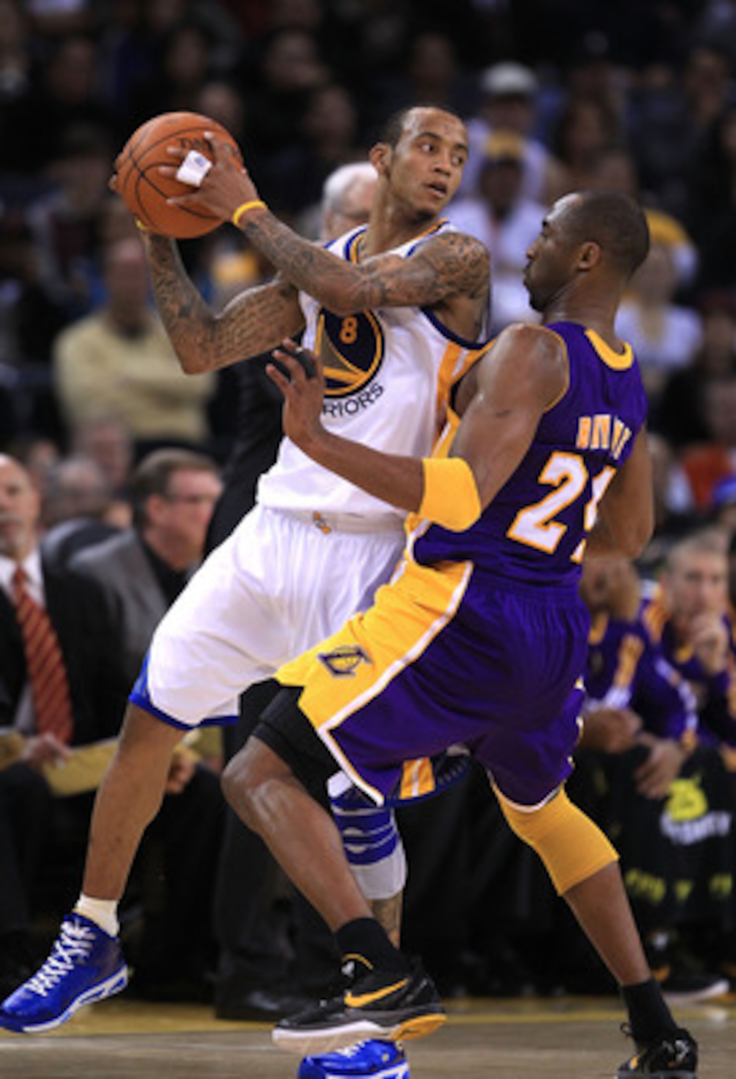 OAKLAND, CA - JANUARY 12: Kobe Bryant #24 of the Los Angeles Lakers plays tight defense on Monta Ellis #8 of the Golden State Warriors at Oracle Arena on January 12, 2011 in Oakland, California. NOTE TO USER: User expressly acknowledges and agrees that, b