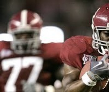 TUSCALOOSA, AL - NOVEMBER 26:  Trent Richardson #3 of the Alabama Crimson Tide is tackled by Nick Fairly #90 of the Auburn Tigers at Bryant-Denny Stadium on November 26, 2010 in Tuscaloosa, Alabama.  (Photo by Kevin C. Cox/Getty Images)