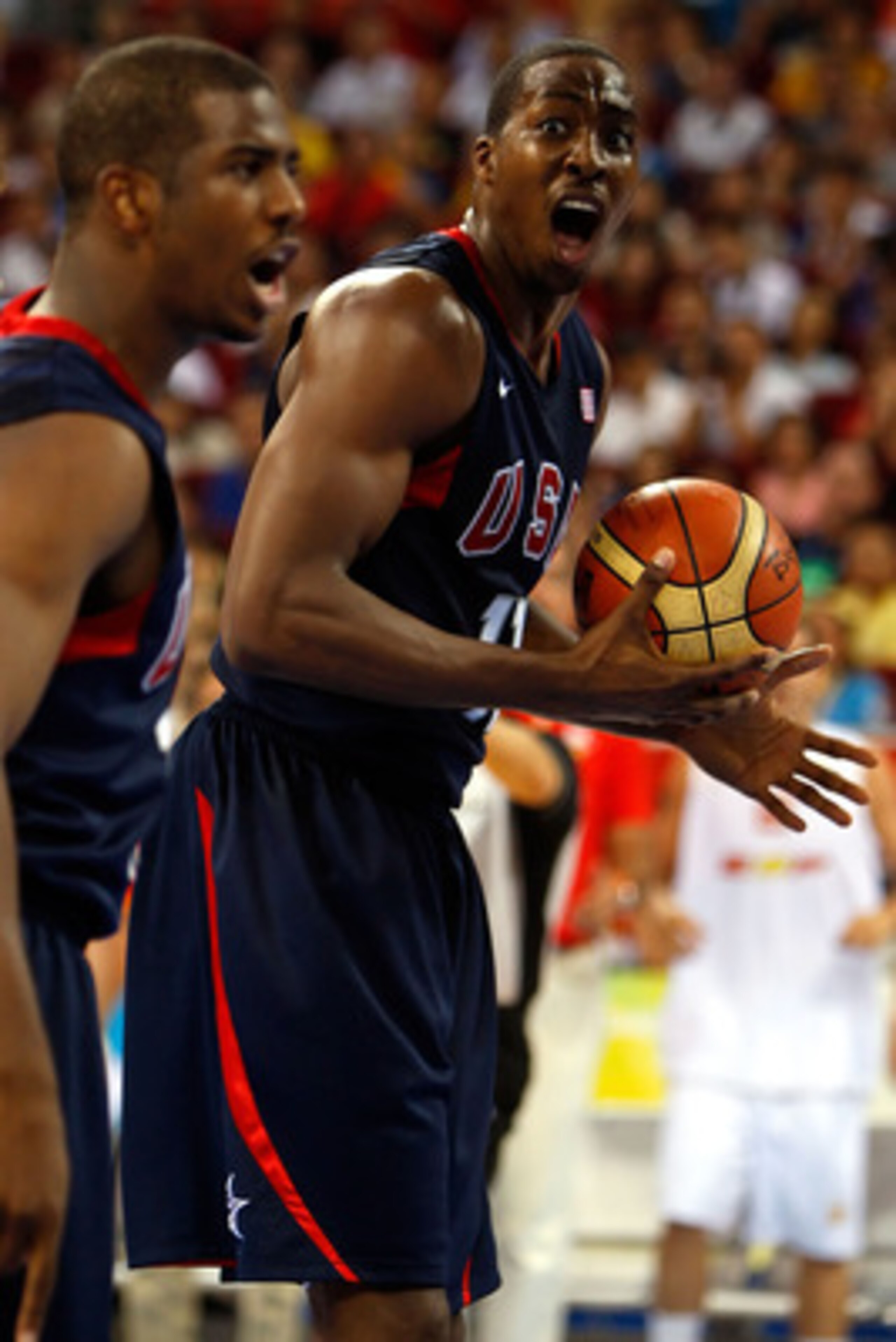 BEIJING - AUGUST 24:  Dwight Howard #11 and Chris Paul #13 of the United States react to a call in the gold medal game against Spain during Day 16 of the Beijing 2008 Olympic Games at the Beijing Olympic Basketball Gymnasium on August 24, 2008 in Beijing,
