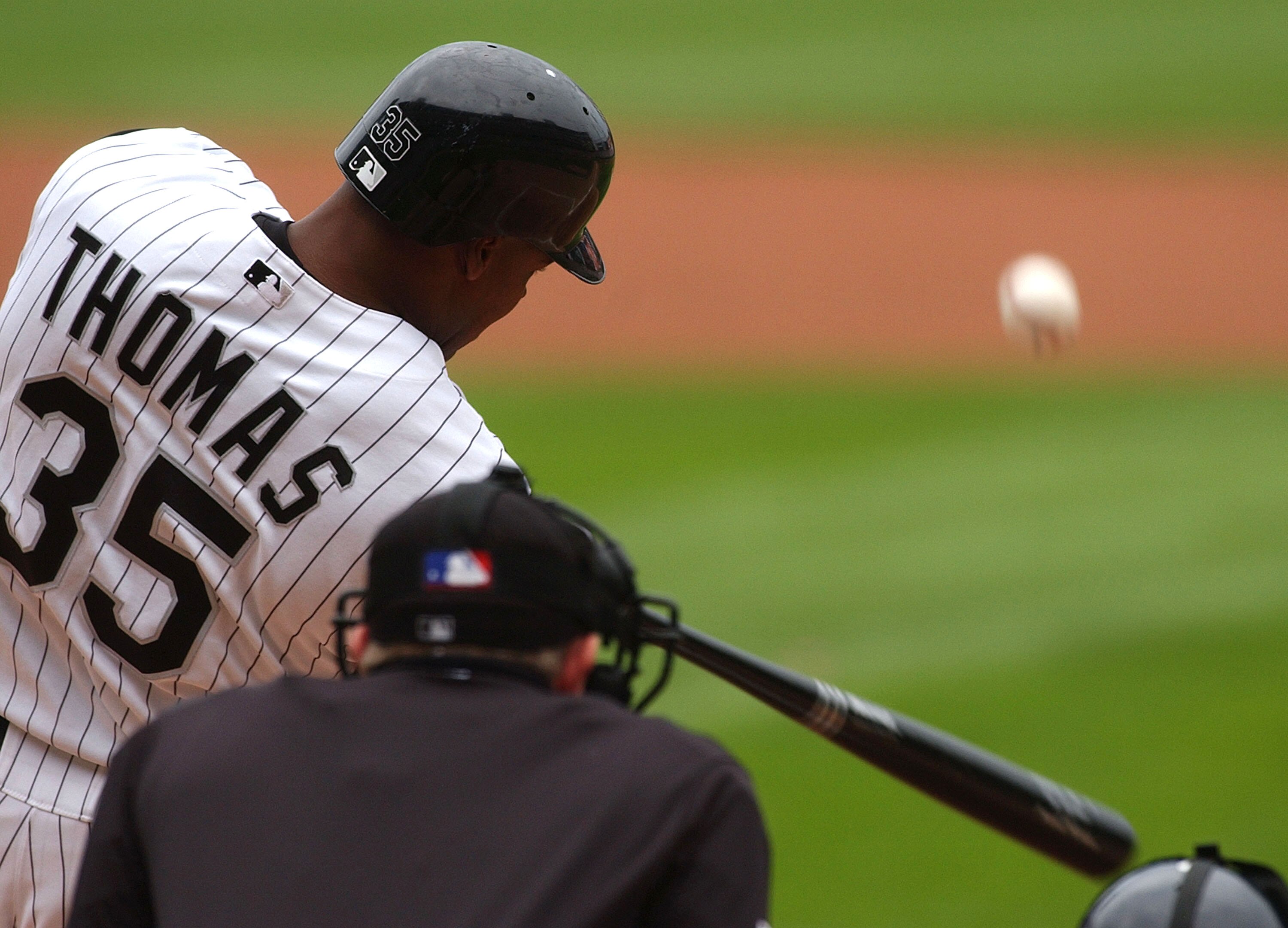 CHICAGO - JUNE 13:  Frank Thomas #35 of the Chicago White Sox hits a solo home run in the first inning against the Atlanta Braves on June 13, 2004 at U.S. Cellular Field in Chicago, Illinois. The White Sox defeated the Braves 10-3.  (Photo by Jonathan Dan